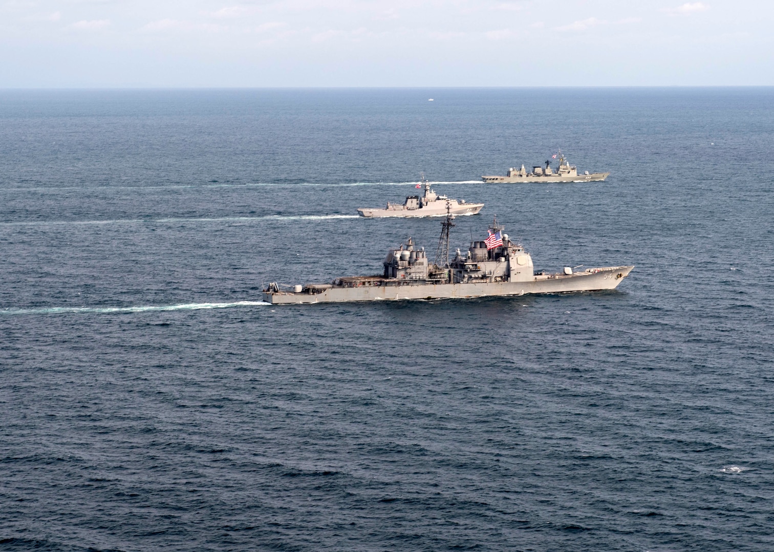 EAST CHINA SEA (Oct. 9, 2018) The Ticonderoga-class guided-missile cruiser USS Antietam (CG 54), the Royal Thai Navy offshore patrol vessel HTMS Krabi (OPV 551) and Royal Thai Navy frigate HTMS Taksin (FFG 422) conduct a tactical maneuvering during a cooperative deployment. Antietam is forward deployed to the U.S. 7th Fleet area of operations in support of security and stability in the Indo-Pacific region.