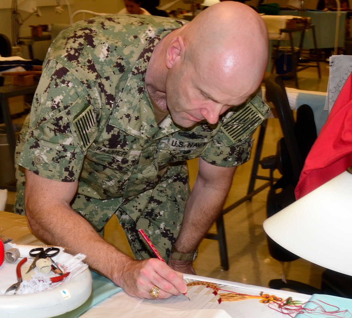 Palmer signs presidential flag at Troop Support