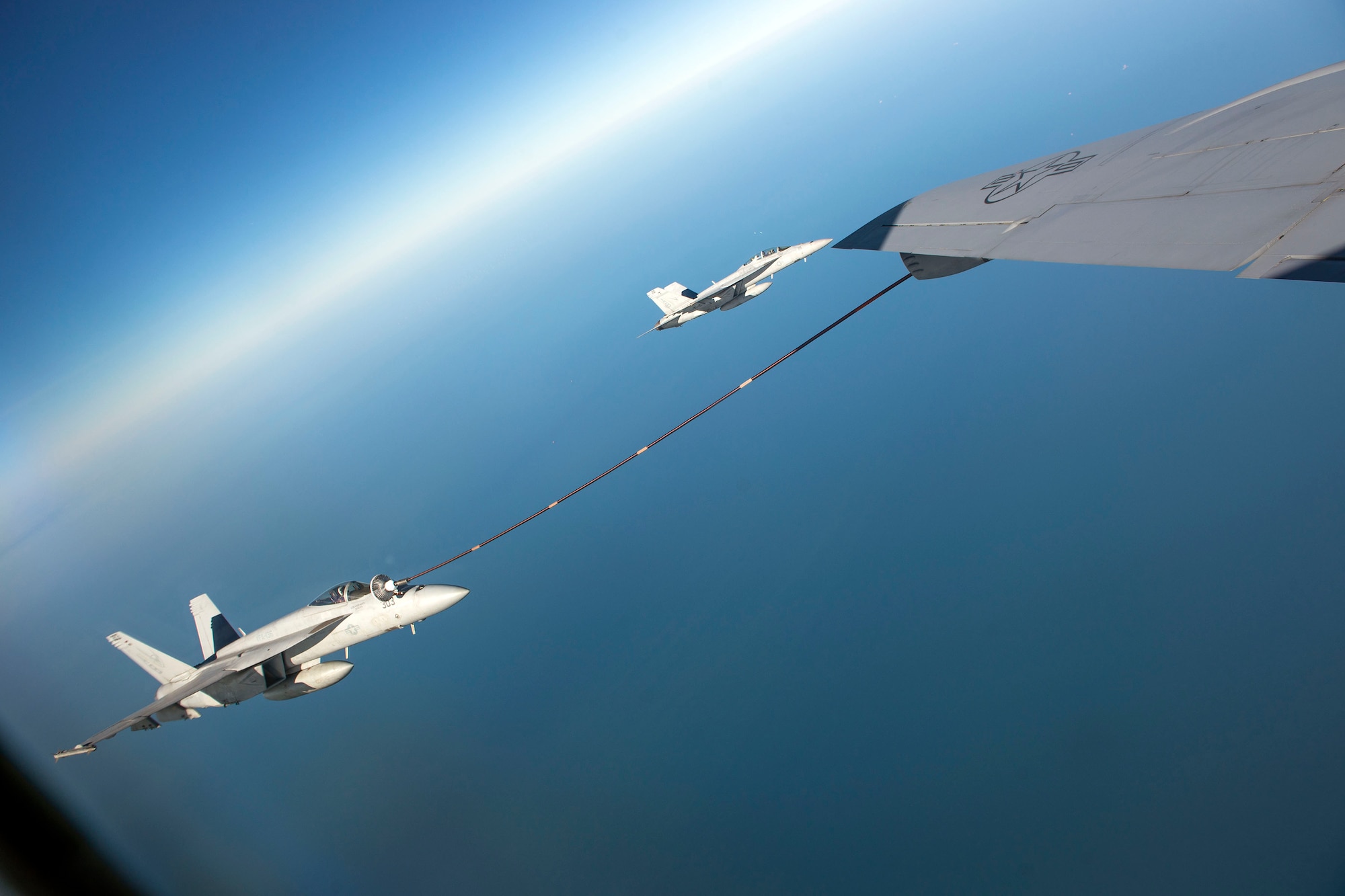 U.S. Navy F/A-18 Super Hornets assigned to the Carrier Air Wing from the USS Harry S. Truman (CVN-75), receive fuel from a U.S. Air Force KC-135 Stratotanker from RAF Mildenhall, during a large forces exercise off the coast of England, Oct. 10, 2018. RAF Lakenheath hosted a large force exercise that demonstrated U.S. ability to deter current and potential threats. (U.S. Air Force photo by Staff Sgt. Christine Groening)