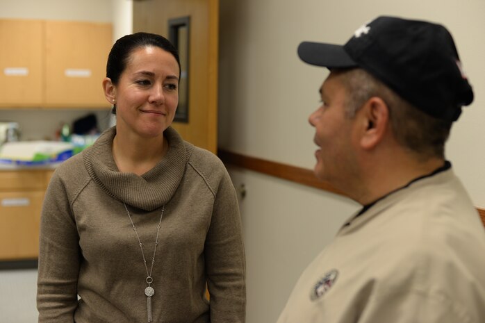 Chief Master Sgt. Eryn McElroy, 341st Missile Wing command chief, talks to Lt. Col. Paul Castillo, 341st MW chaplain, during a dorm dinner Sept. 27, 2018, at Malmstrom Air Force Base, Mont.