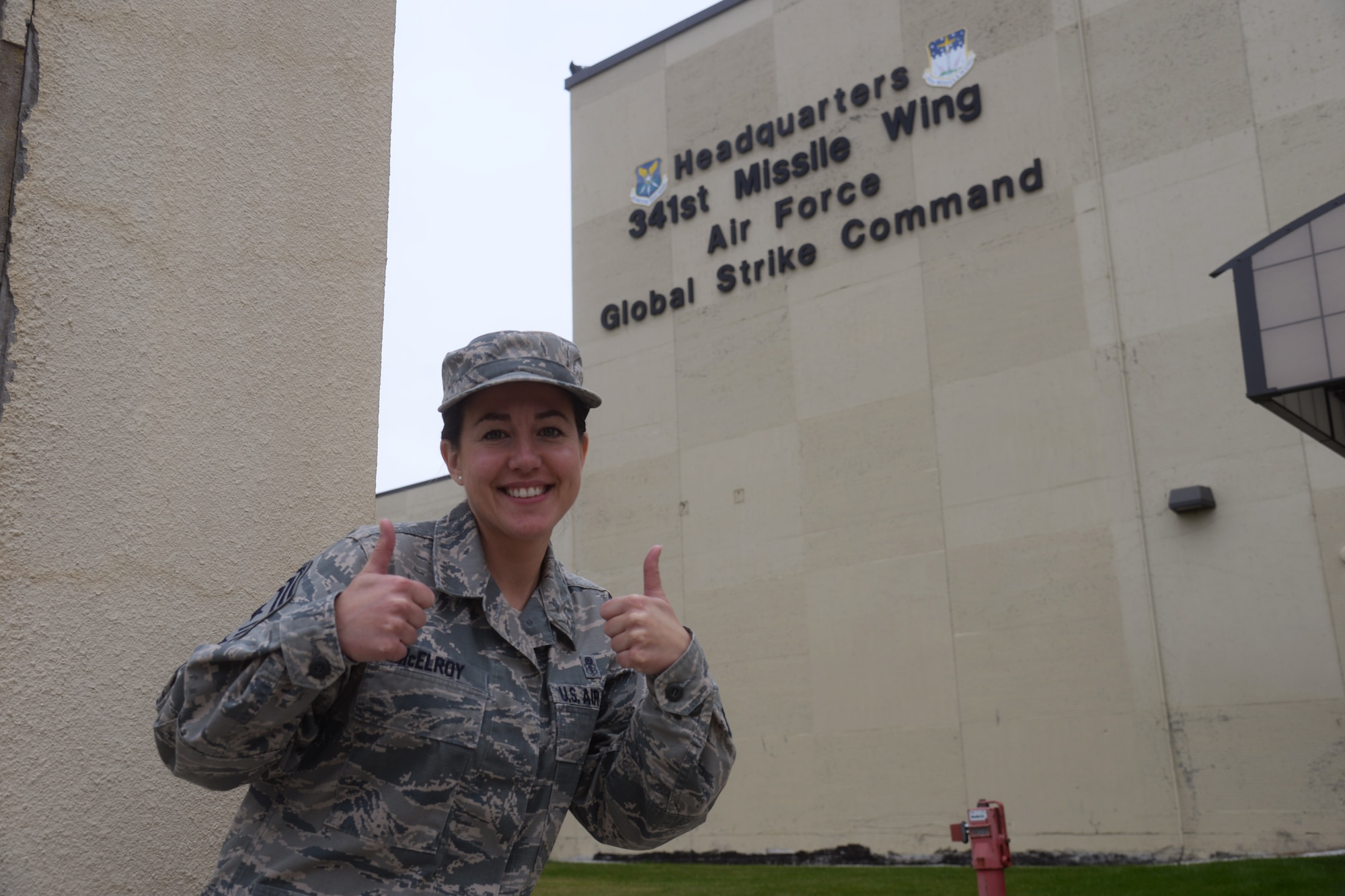 Chief Master Sgt. Eryn McElroy, 341st Missile Wing command chief, poses outside of base headquarters Oct. 4, 2018, at Malmstrom Air Force Base, Mont.