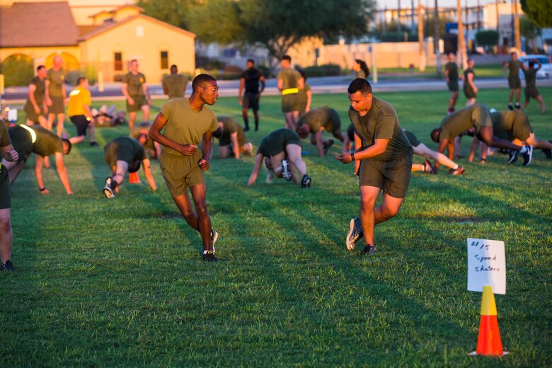 Marines, Sailors, and civilians aboard Marine Corps Air Station (MCAS) Yuma participate in High Intensity Tactical Training (HITT) on the Lawn, at the parade deck on MCAS Yuma, Ariz., Sept. 28, 2018. HITT on the Lawn is a physical training event that is open to anyone with base access and provides them with a physical training opportunity. (U.S. Marine Corps photo taken by Cpl. Isaac D. Martinez)