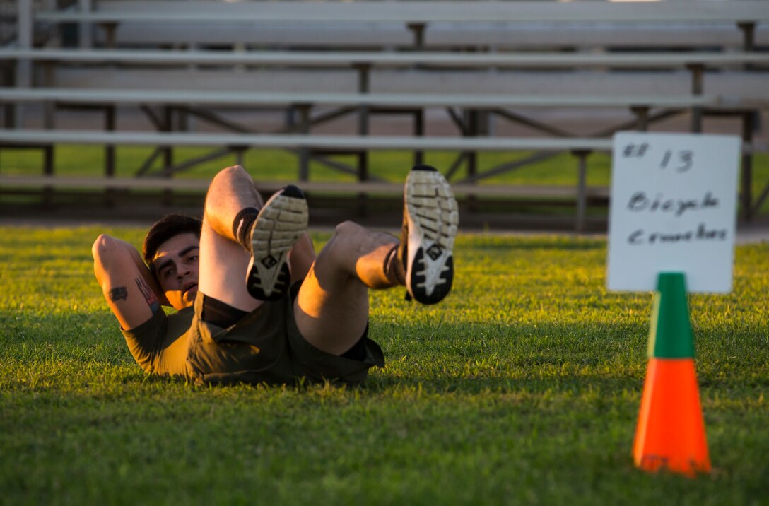 Lance Cpl. Joel Soriano, a combat photographer assigned to Headquarters and Headquarters Squadron (H&HS), performs “bicycle kicks” during High Intensity Tactical Training (HITT) on the Lawn, at the parade deck on Marine Corps Air Station Yuma, Ariz., Sept. 28, 2018. HITT on the Lawn is a physical training event that is open to anyone with base access and provides them with a physical training opportunity. (U.S. Marine Corps photo taken by Cpl. Isaac D. Martinez)