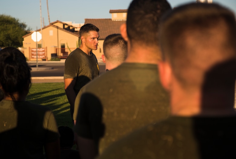 Lt. Col. James C. Paxton III, the commanding officer of Headquarters and Headquarters Squadron (H&HS), speaks to a group of Marines assigned to H&HS about the importance of physical training, just after the completion of High Intensity Tactical Training (HITT) on the Lawn, at the parade deck on Marine Corps Air Station Yuma, Ariz., Sept. 28, 2018. HITT on the Lawn is a physical training event that is open to anyone with base access and provides them with a physical training opportunity. (U.S. Marine Corps photo taken by Cpl. Isaac D. Martinez)