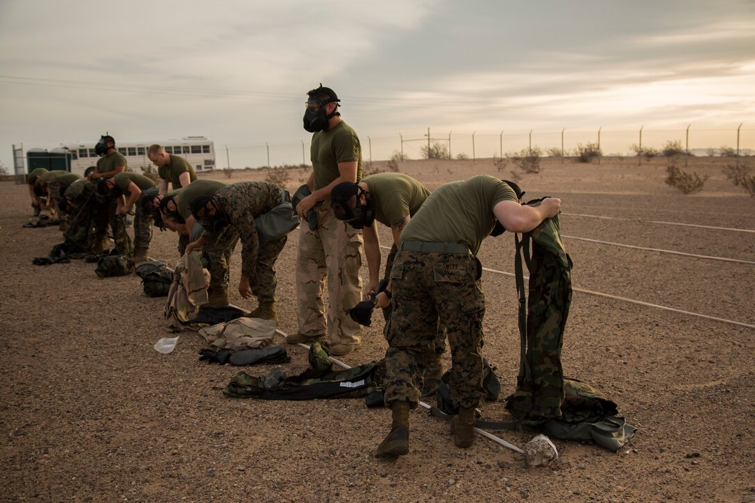 U.S. Marines stationed at Marine Corps Air Station (MCAS) Yuma, conduct their annual Chemical, Biological, Radiological and Nuclear Defense (CBRN) Training at the MCAS Yuma Gas Chamber July 26, 2018. The gas chamber is a controlled environment in which a non-lethal gas is released. This trains Marines to have confidence in their gear and become familiar with the effects of gas. (U.S. Marine Corps Photos by Lance Cpl. Sabrina Candiaflores)