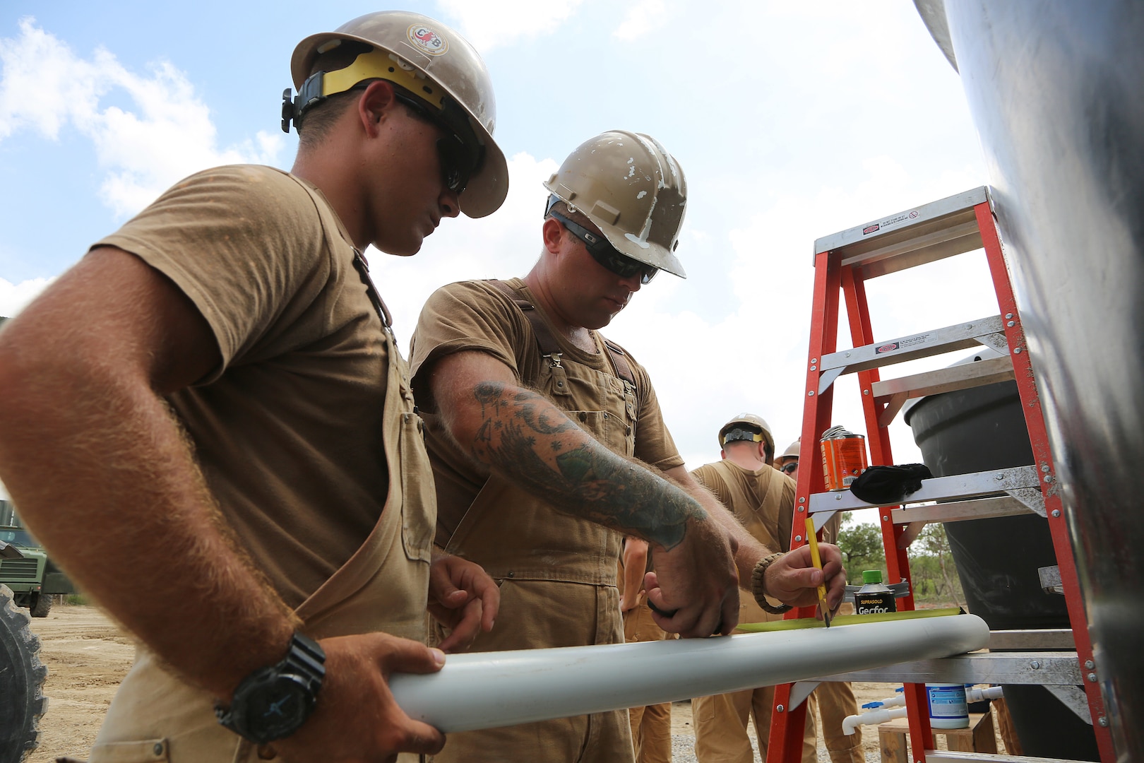 U.S. Navy Seabees mark the location of a plumbing fixture in Riohacha, Colombia, Sept. 27, 2018,