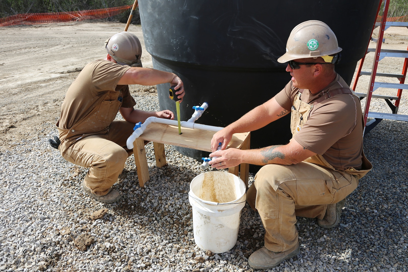 U.S. Navy Seabees take a measurement in Riohacha, Colombia, Sept. 27, 2018, during water-well drilling exploration operations as part of Southern Partnership Station 2018