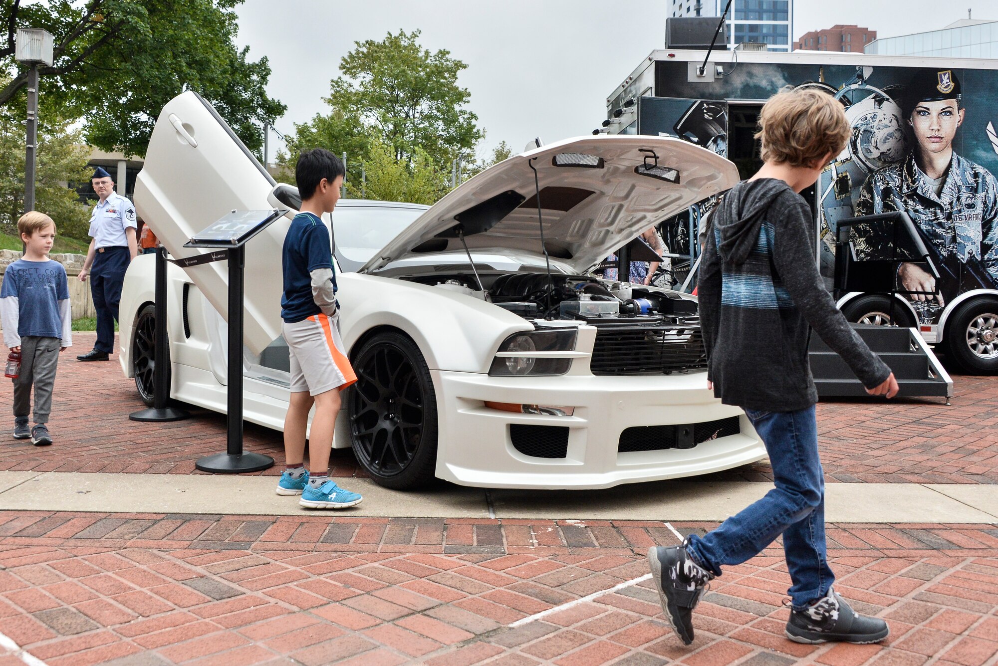 Local Maryland children inspect the Ford Mustang (X-1) during Fleet Week October 6, 2018 in Baltimore, Maryland. The X-1 is part of an Air Force Recruiting Service 2009 Super Car Tour recruiting initiative that kicked off in May of 2009. (U.S. Air Force photo by Staff Sgt. Alexandre Montes)