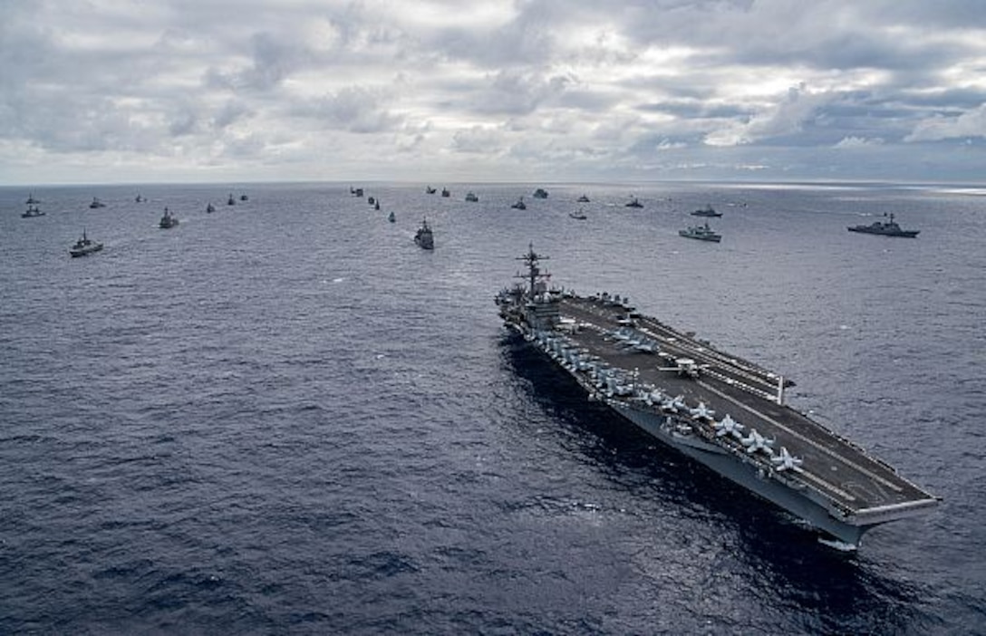 Ships sail in formation.