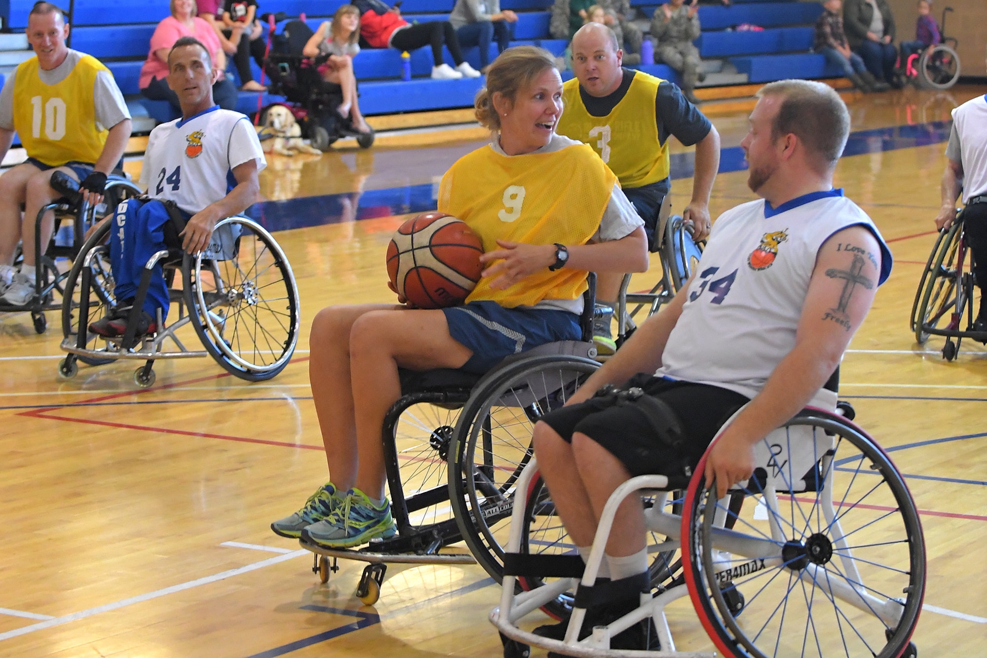 Col. Regina Sabric, 419th Fighter Wing commander, during a wheelchair basketball game Oct. 3, 2018, at Hill Air Force Base, Utah. Leadership from units across the base faced off against Ogden's Wheelin' Wildcarts, a semi-professional wheelchair basketball team, to celebrate Disability Awareness Month. (U.S. Air Force photo by Todd Cromar)
