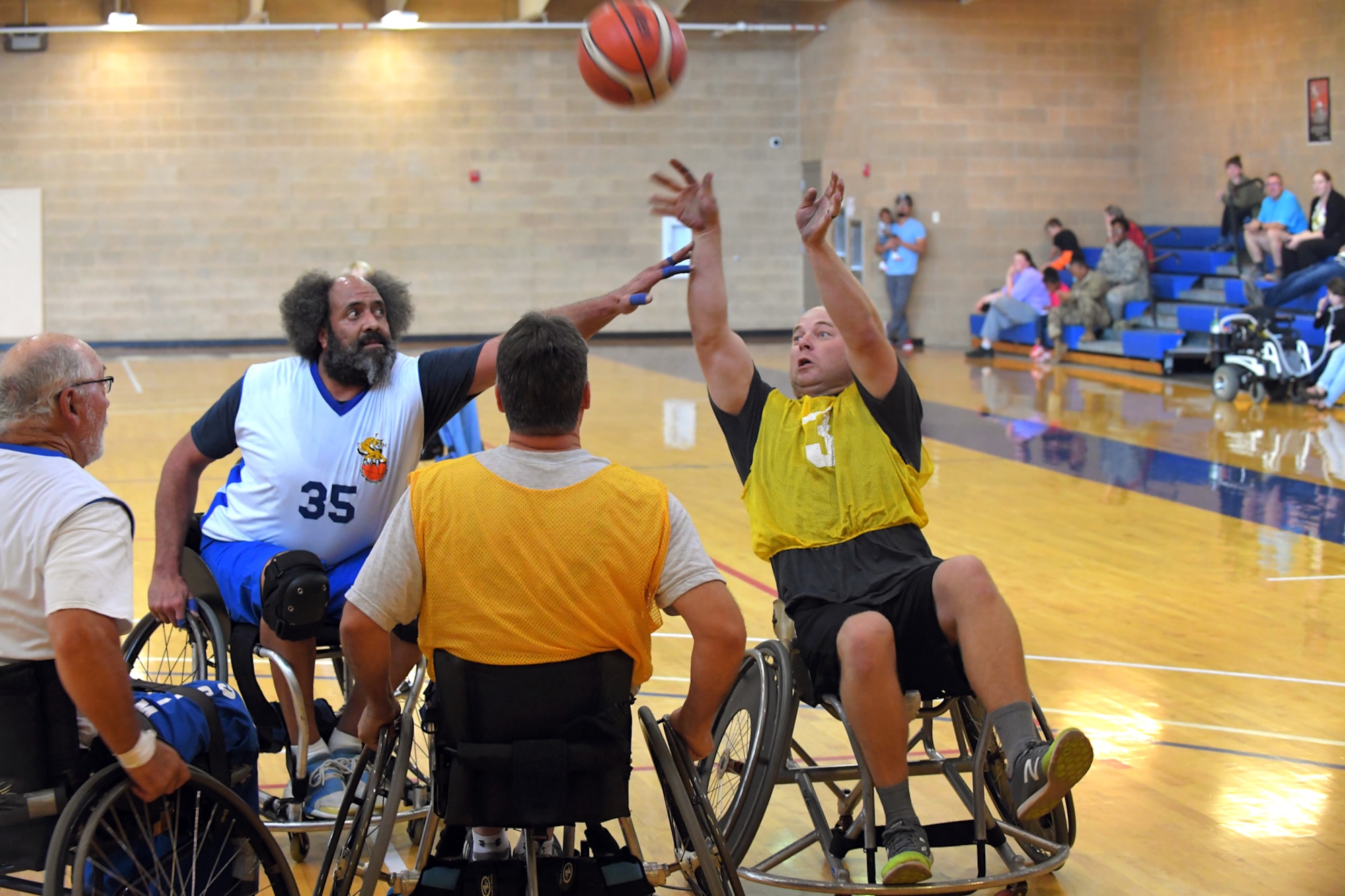 Players scramble for possession of the ball during a wheelchair basketball game Oct. 3, 2018, at Hill Air Force Base, Utah. Leadership from units across the base faced off against Ogden's Wheelin' Wildcarts, a semi-professional wheelchair basketball team, to celebrate Disability Awareness Month. (U.S. Air Force photo by Todd Cromar)