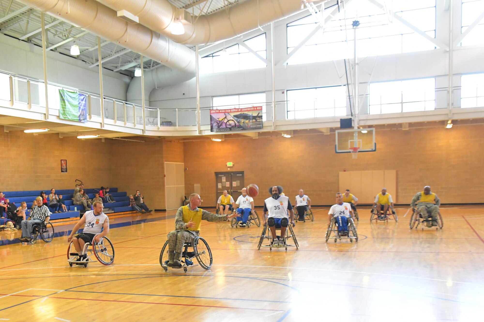 Col. Jon Eberlan, 75th Air Base Wing commander, on a fast break during a wheelchair basketball game Oct. 3, 2018, at Hill Air Force Base, Utah. Leadership from units across the base faced off against Ogden's Wheelin' Wildcarts, a semi-professional wheelchair basketball team, to celebrate Disability Awareness Month. (U.S. Air Force photo by Todd Cromar)