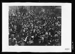 American Doughboys surrounded by French civilian celebrate the Armistice in Paris.