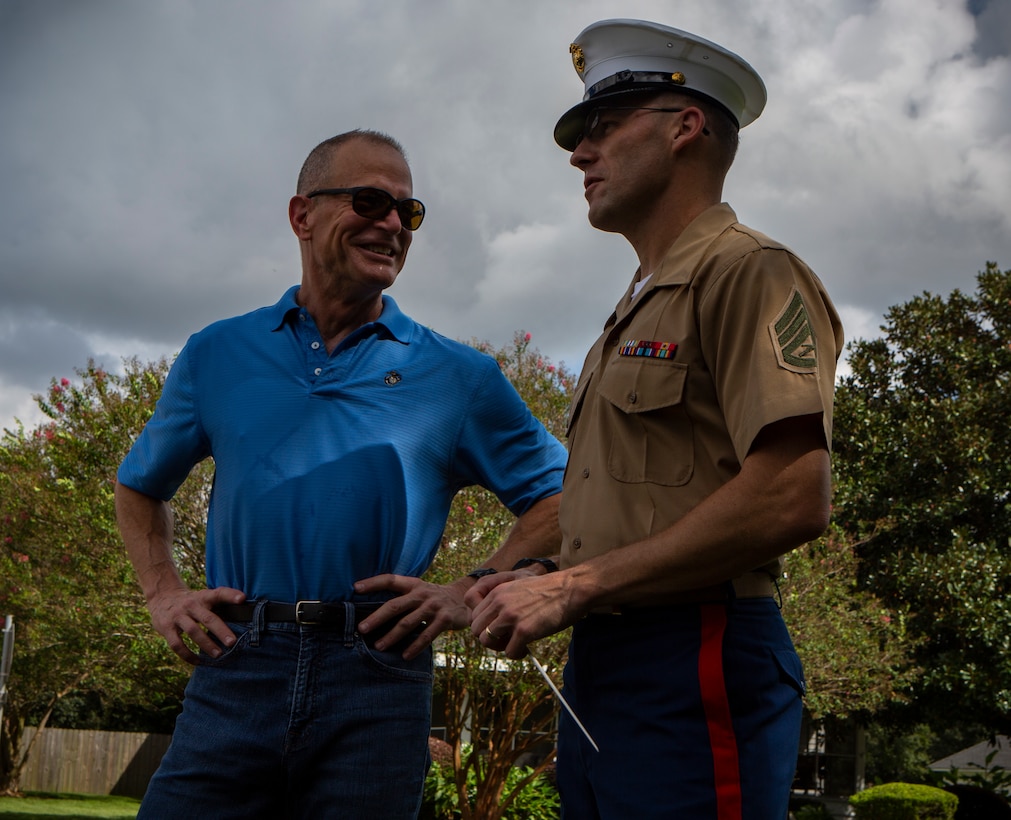 Maj. Gen. Burke W. Whitman, commander of Marine Forces Reserve and Marine Forces North, speaks with Staff Sgt. Marcus Bailey, enlisted conductor with the MARFORRES Band, during the Algiers Festival 2018 in Federal City, New Orleans, Oct. 6, 2018. The band performed to show their support towards the New Orleans community and kicked off the Algiers Festival 2018. (U.S. Marine Corps photo by Cpl, Andy O. Martinez)