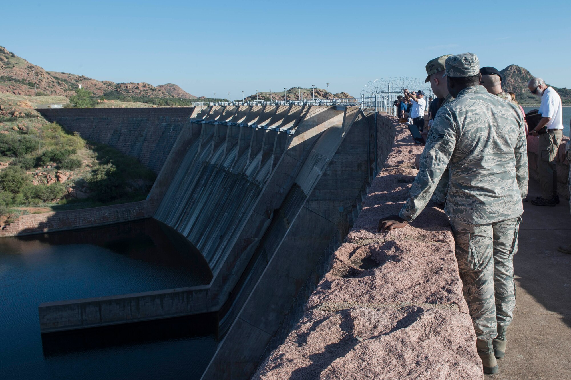 Members of the 97th Air Mobility Wing look at the Lake Altus-Lugert outflow, during the tour of the dam, Oct. 5, 2018, in Lugert, Okla.