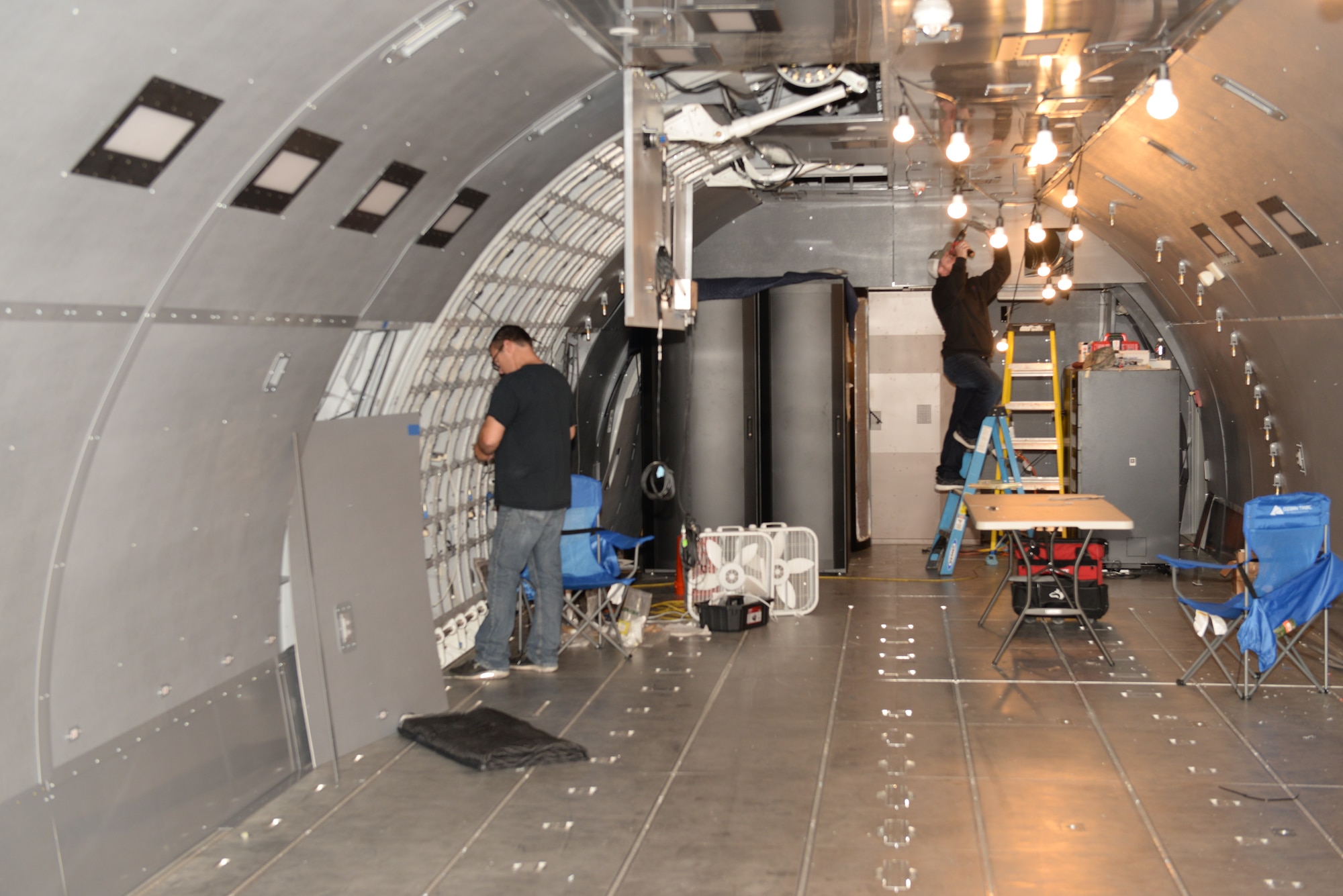 Contractors put the finishing touches on the KC-46A fuselage trainer (FuT) in preparation for the training of aircrews starting Dec. 5, Pease Air National Guard Base, N.H, Oct. 9, 2018. The FuT is used to train KC-46 boom operators on cargo handling, aircraft maintainers on proper procedures and pilots on egress. (Photo by Master Sgt. Thomas Johnson, 157th ARW Public Affairs)