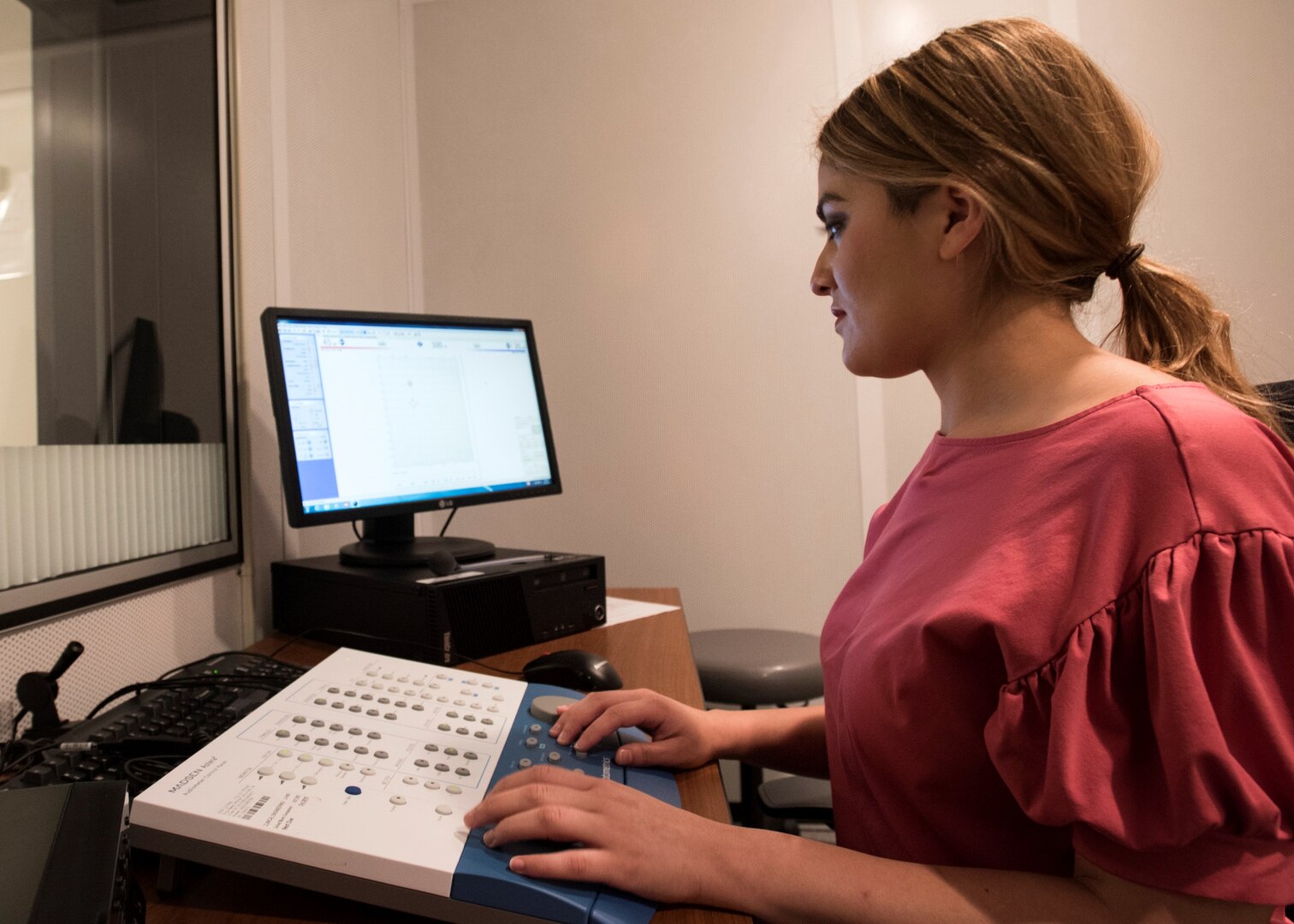 Dr. Rozela Melgoza, Department of Defense Hearing Center of Excellence research audiologist at Wilford Hall Ambulatory Medical Center on Joint Base San Antonio-Lackland, completes a study participant's puretone air conduction thresholds to evaluate the entire auditory pathway. Puretone audiometry is one of several tests completed during the 59th Medical Wing’s, in partnership with the HCE, Noise Outcomes in Service members Epidemiology study to help researchers examine and better understand how the long-term progression of hearing impairment and tinnitus among active duty service members is related to military and post-military exposures.