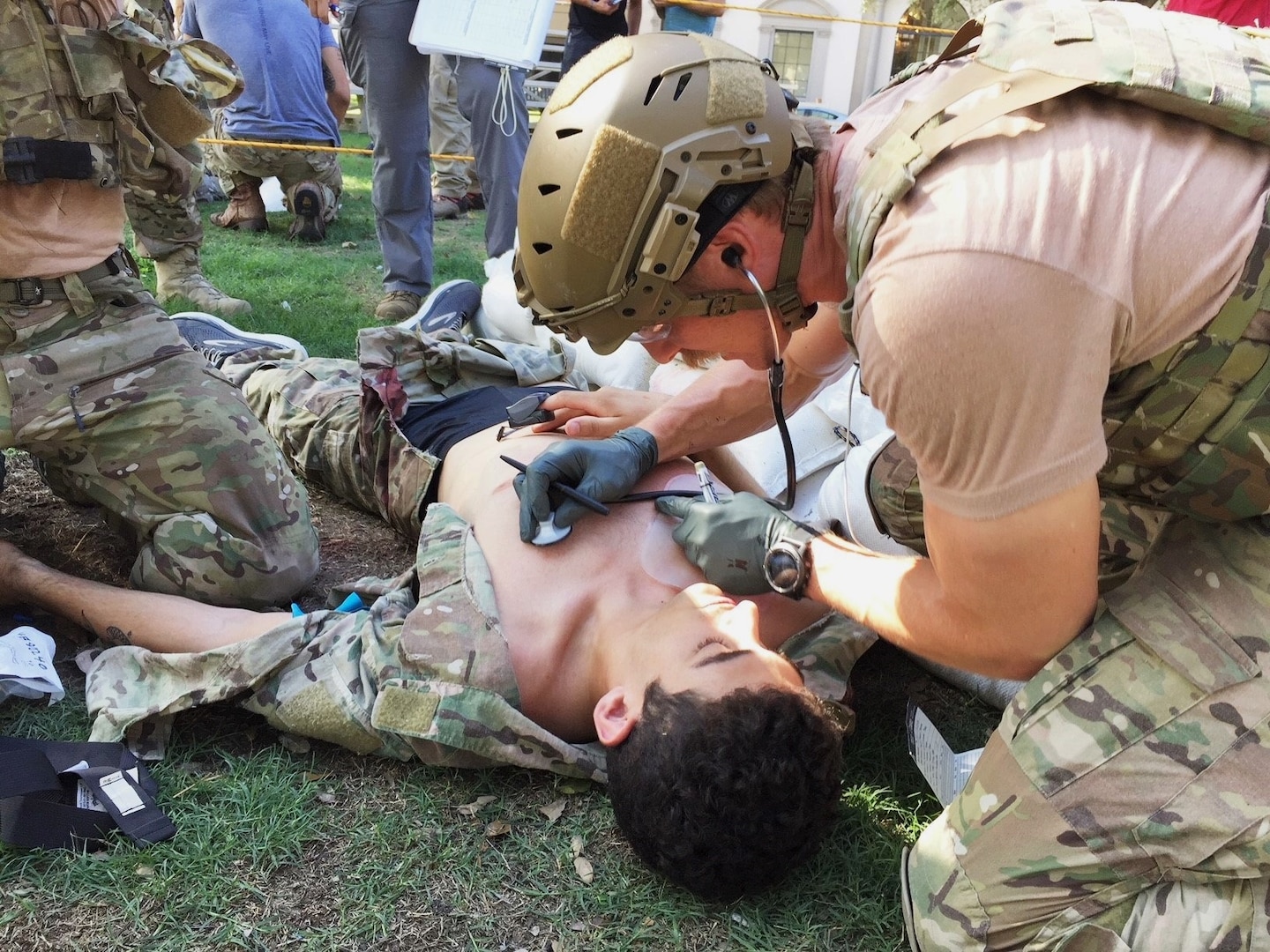 U.S. Air Force Pararescuemen, 304th Rescue Squadron Portland, Oregon, provide medical attention to Airman First Class James Pedrie, PJ Rodeo volunteer, for a simulated gunshot wound at the PJ Rodeo in San Antonio, Texas, Sept. 19, 2018. The PJ Rodeo provides comradery, networking opportunities, and serves as a source of additional training for competitors.