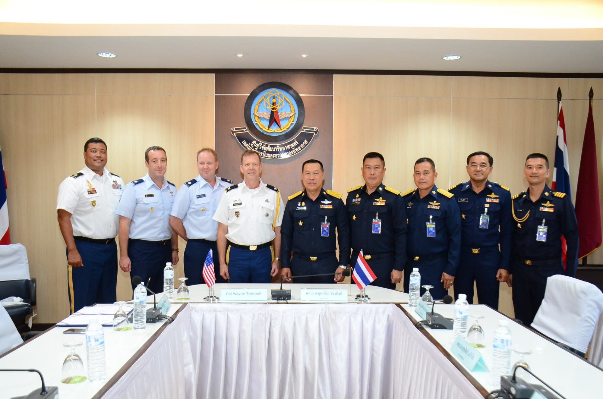 Royal Thailand Air Force Air Marshal Yuttachai Watcharasing (center) and U.S. Army Col. Wayne Turnbull, senior defense official and defense attaché to Thailand (4th from left), along with Royal Thailand Air Force and U.S. Embassy in Thailand representatives celebrate the signing of an agreement for space situational awareness services and data, Oct. 1, 2018, in Thailand. Agreements like these bolsters the United States and Thailand’s awareness in the space domain. (Courtesy Photo)