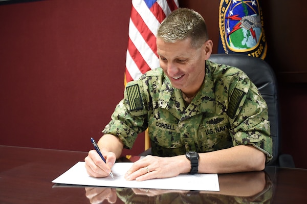 U.S. Navy Rear Adm. Richard Correll, U.S. Strategic Command (USSTRATCOM) director of plans and policy, signs an agreement to share space situational awareness services and information with Thailand at USSTRATCOM headquarters on Offutt Air Force Base, Neb, Oct. 11, 2018. Agreements like these lay the foundation that allows the United States to share information with allies and partners. (U.S. Air Force photo by Master Sgt. April Wickes)