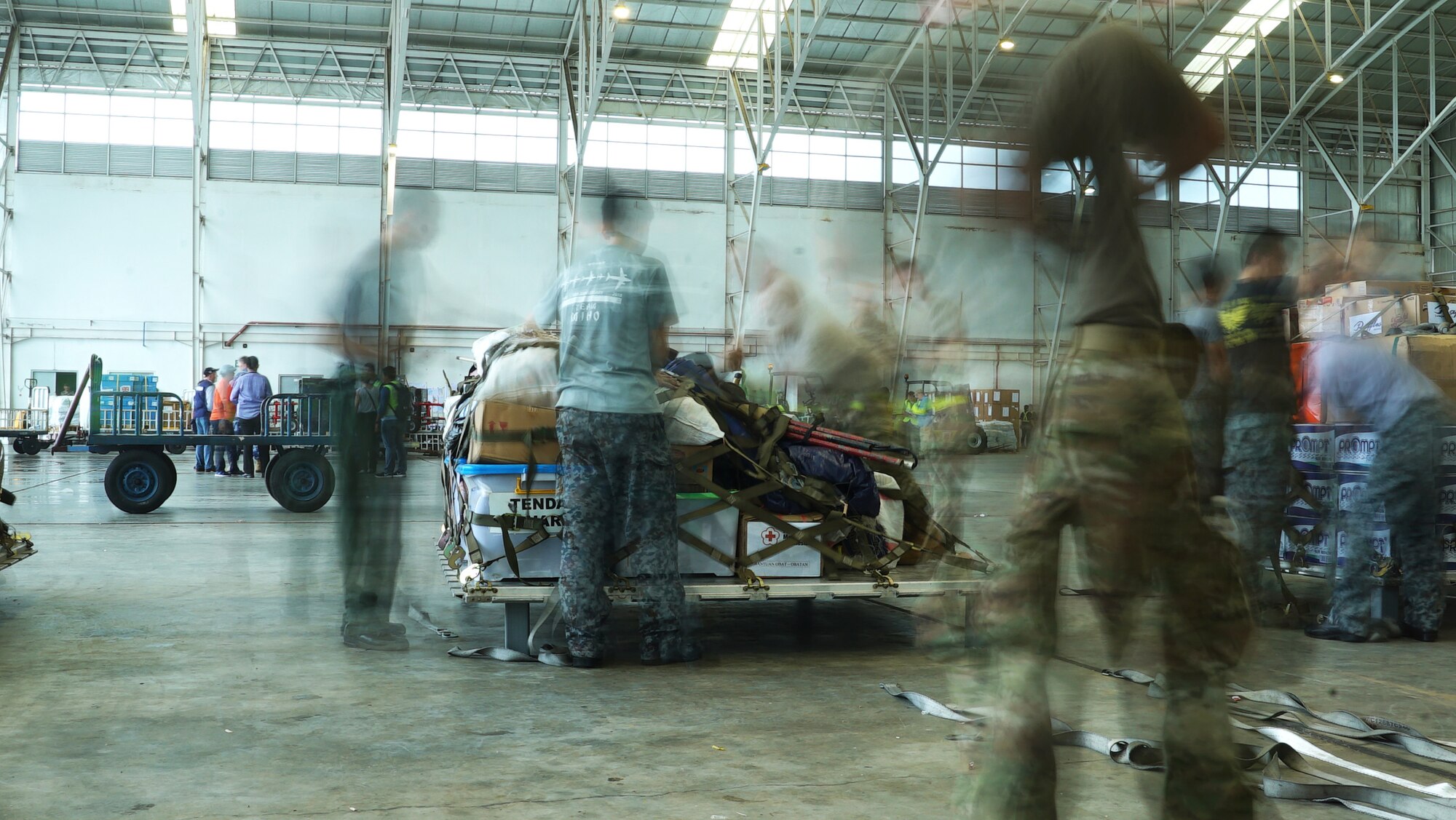 Military members from various countries work together to build pallets in Balikpapan, Idonesia Oct. 7, 2018.