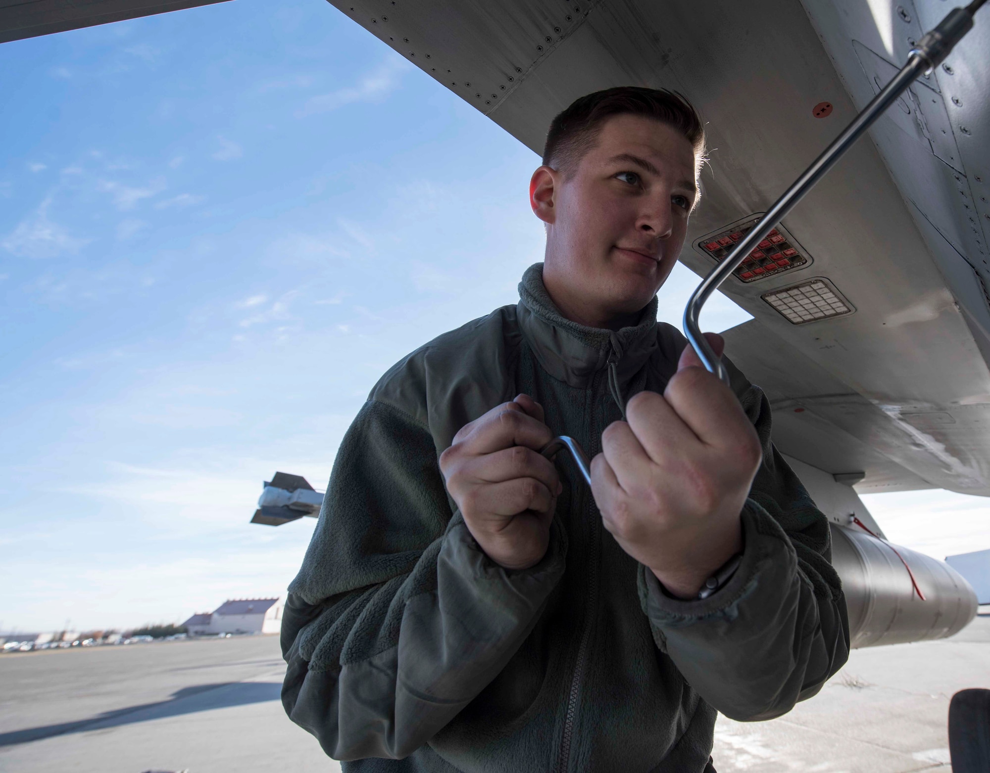 U.S. Air Force Airman 1st Class Kelsie Walls, a 13th Aircraft Maintenance Unit crew chief, tightens a screw on an F-16 Fighting Falcon during exercise Red Flag-Alaska 19-1, at Eielson Air Force Base, Alaska, Oct. 9, 2018. Maintainers repair jets alongside joint and multilateral partners from around the world affording them opportunities to exchange tactics, operations techniques and procedures which improves international interoperability. (U.S. Air Force photo by Airman 1st Class Collette Brooks)