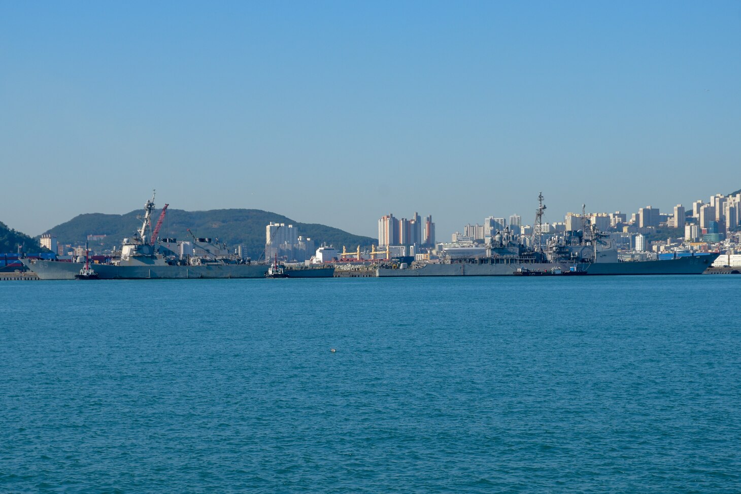 BUSAN, Republic of Korea (Oct. 12, 2018) Arleigh Burke-class guided-missile destroyer USS Benfold (DDG 65) and Ticonderoga-class guided-missile cruiser USS Chancellorsville (CG 62)arrives in Commander, Republic of Korea Fleet base pier as part of a regularly scheduled port visit. Benfold and Chancellorsville are underway with the USS Ronald Reagan (CVN 76) Carrier Strike Group and are forward deployed to the U.S. 7th Fleet area of operations in support of security and stability in the Into-Pacific region.