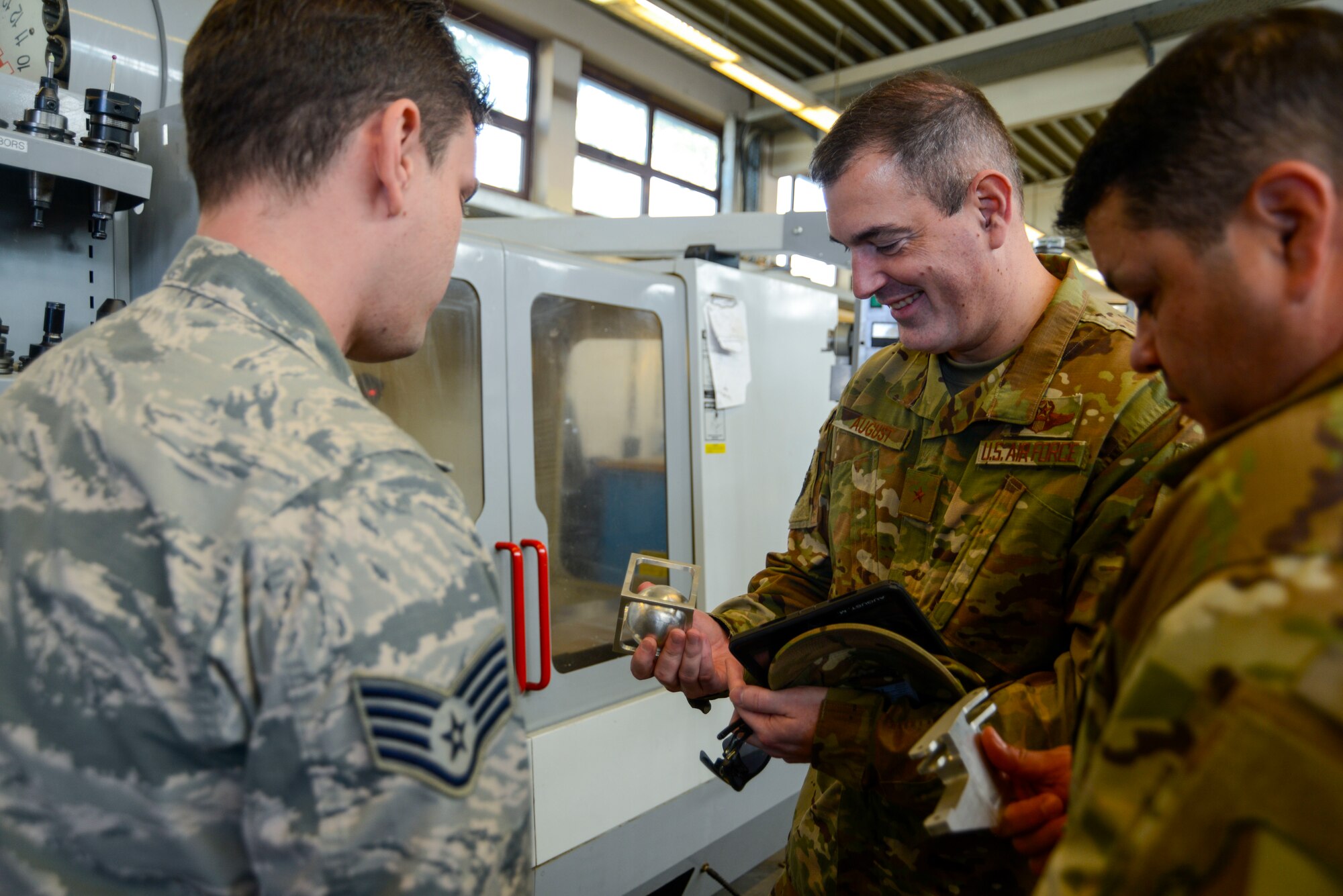 U.S. Air Force Brig. Gen. Mark R. August, 86th Airlift Wing commander, and Chief Master Sgt. Ernesto J. Rendon Jr., 86th AW command chief, view some of the complex items the 86th Maintenance Squadron Metals Technology Flight can fabricate during an immersion tour of the 86th Maintenance Group on Ramstein Air Base, Germany, Oct. 9, 2018. The command team used the immersion as a way to get a better understanding of the 86th MXG’s capabilities as well as a way for Airmen to ask questions directly to the wing leaders. (U.S. Air Force photo by Staff Sgt. Timothy Moore)
