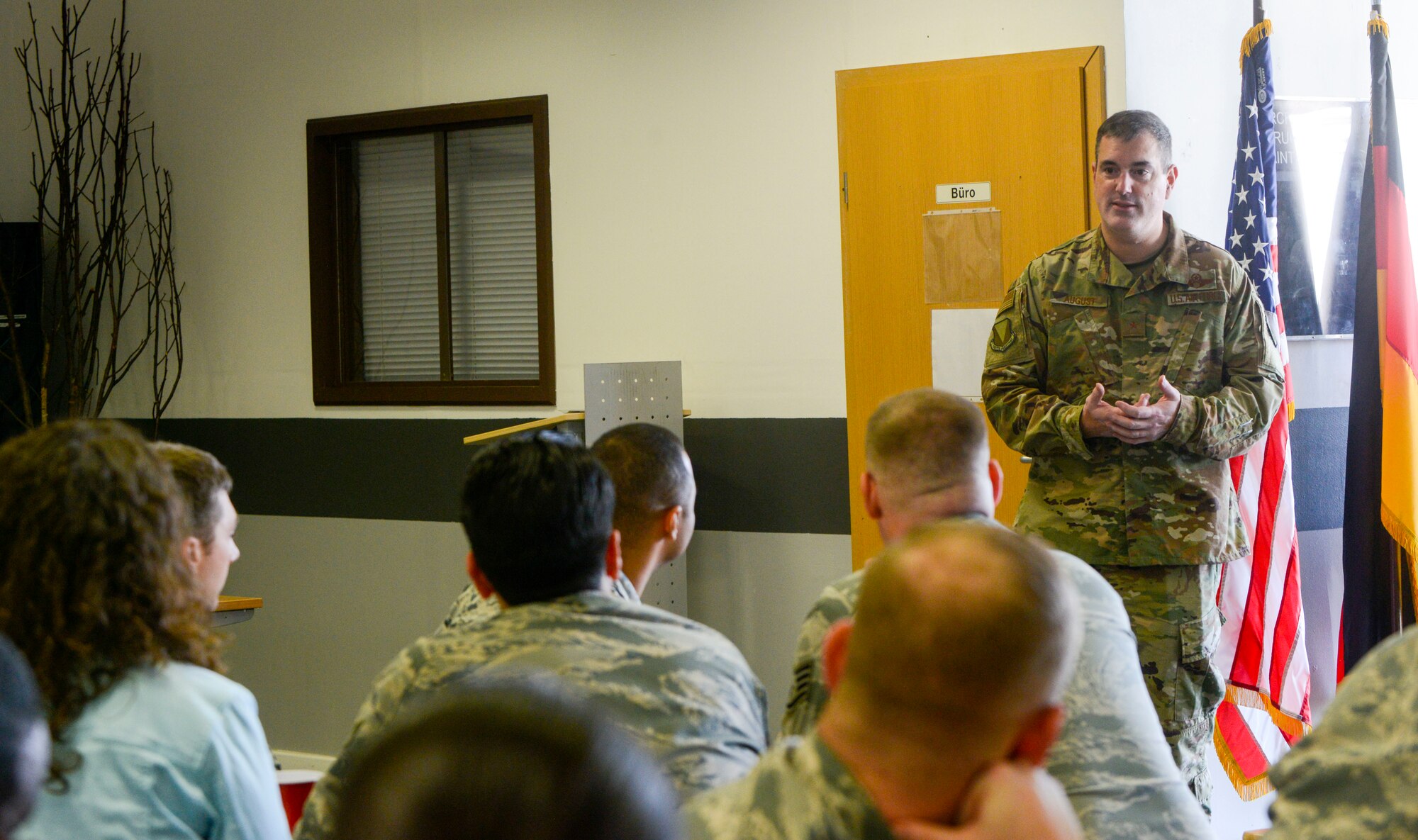 U.S. Air Force Brig. Gen. Mark R. August, 86th Airlift Wing commander, answers questions during an immersion tour of the 86th Maintenance Group on Ramstein Air Base, Germany, Oct. 9, 2018. August and Chief Master Sgt. Ernesto J. Rendon Jr., 86th AW command chief, used the immersion as a way to get a better understanding of the 86th MXG’s capabilities as well as a way for Airmen to ask questions directly to the wing leaders. (U.S. Air Force photo by Staff Sgt. Timothy Moore)