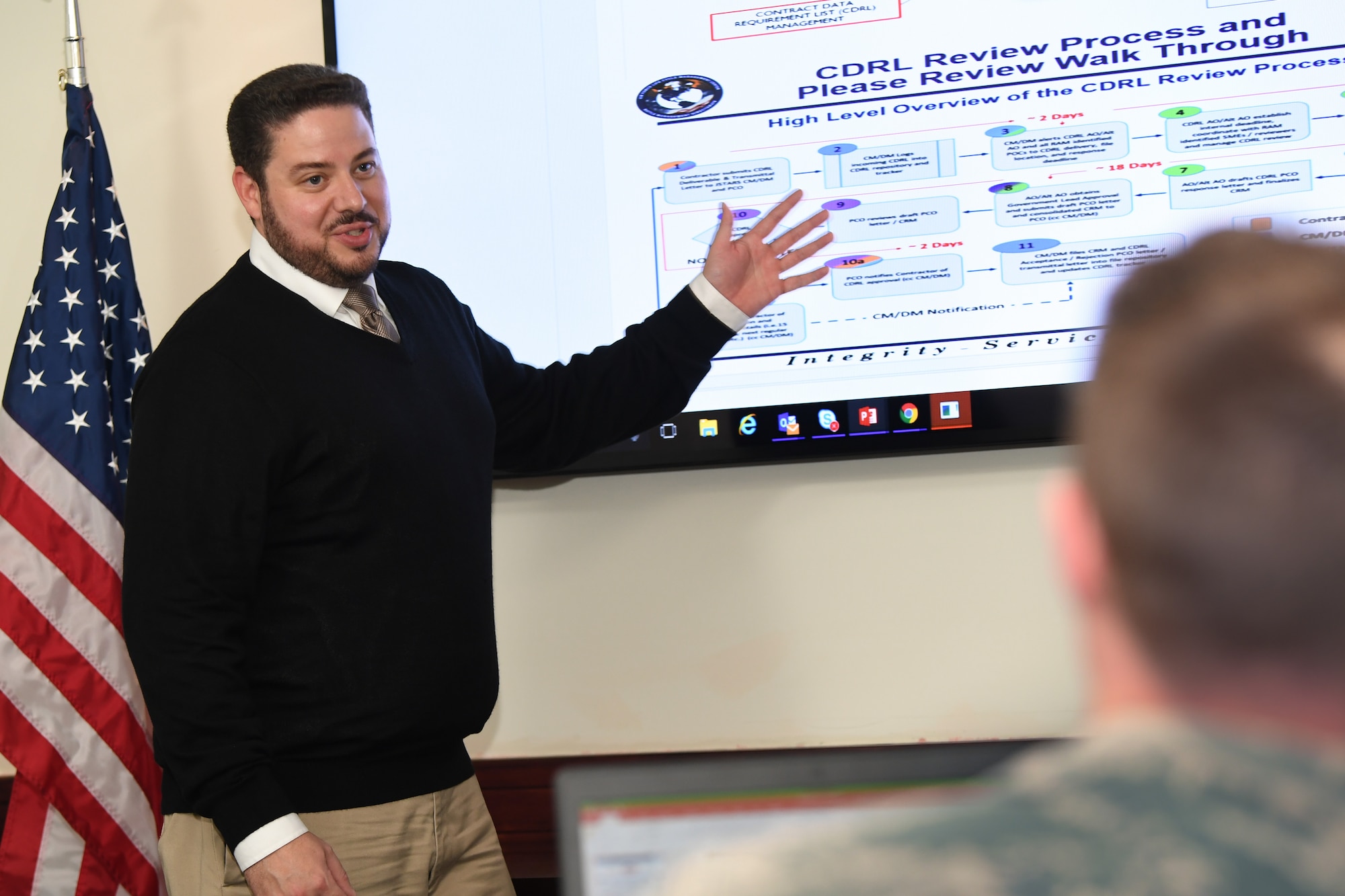 Louis Coco, a support contractor assigned to the Joint STARS Recapitalization program within the PEO Digital portfolio, demonstrates a content sharing application that allows acquisition professionals to ditch Excel, manually-tracked comment resolution matrices, emails and clunky SharePoint workflow systems for cheap, cloud-hosted software solutions at Hanscom Air Force Base, Mass., Oct. 11, 2018. (U.S. Air Force Photo by Todd Maki)