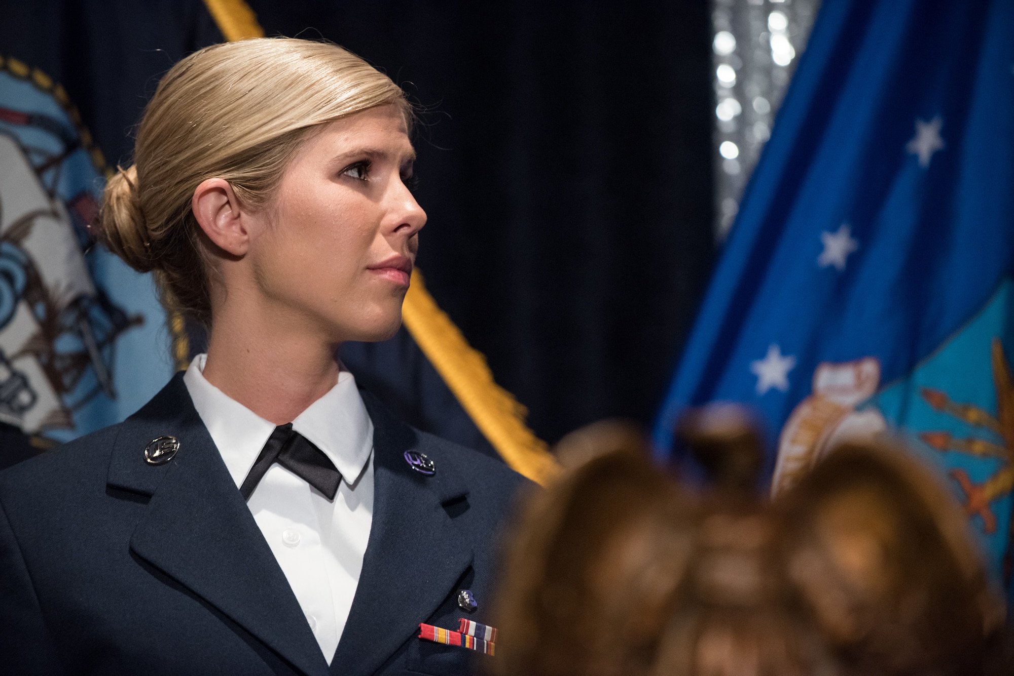 U.S. Air Force Senior Airman Linda M. Wilson, recipient of a 2018 Angel of the Battlefield award, stands onstage during the 2018 Armed Services YMCA Angels of the Battlefield Awards Gala in Arlington, Virginia, Oct. 2, 2018. Wilson risked her own life to save the lives of others during the deadly mass shooting at the Route 91 Harvest Festival in Las Vegas, Nevada on Oct. 1, 2017. Despite the danger, Wilson flagged down numerous cars to transport wounded victims, obtained first-aid supplies and utilized those supplies in treating victims. When she ran out of medical supplies, Wilson directed the use of clothing for improvised tourniquets, and then loaded eight critically injured victims into a car, providing lifesaving treatment throughout the trip to the hospital. (DoD photo by U.S. Army Sgt. James K. McCann)