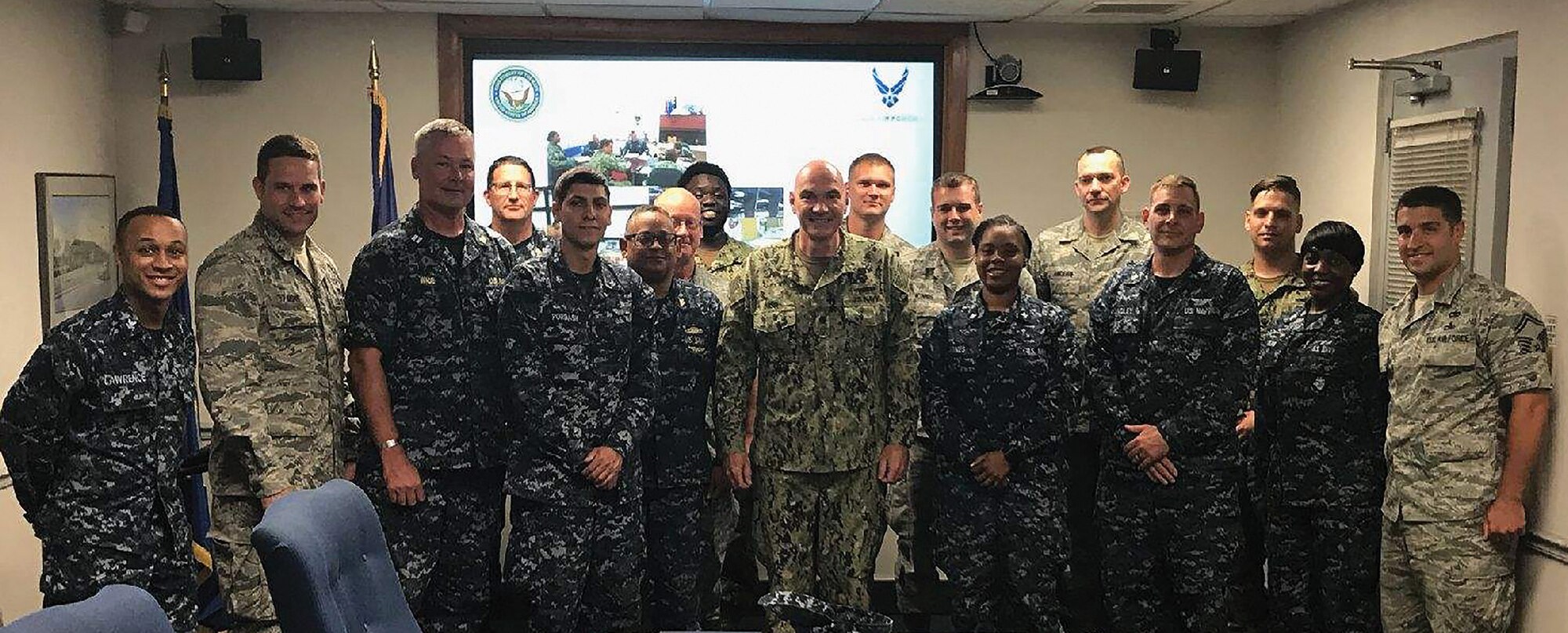 Airmen from the 87th Aerial Port Squadron alongside their Naval counterparts take time out to reflect on what they accomplished during Patriot Partner 2018 held July 6-20, 2018 at Norfolk Naval Air Station's Navy Operated Air Mobility Command Terminal.