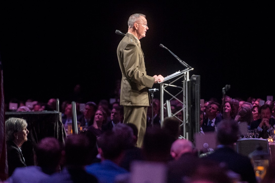 Marine Corps Gen. Joe Dunford stands behind a podium while making a speech.