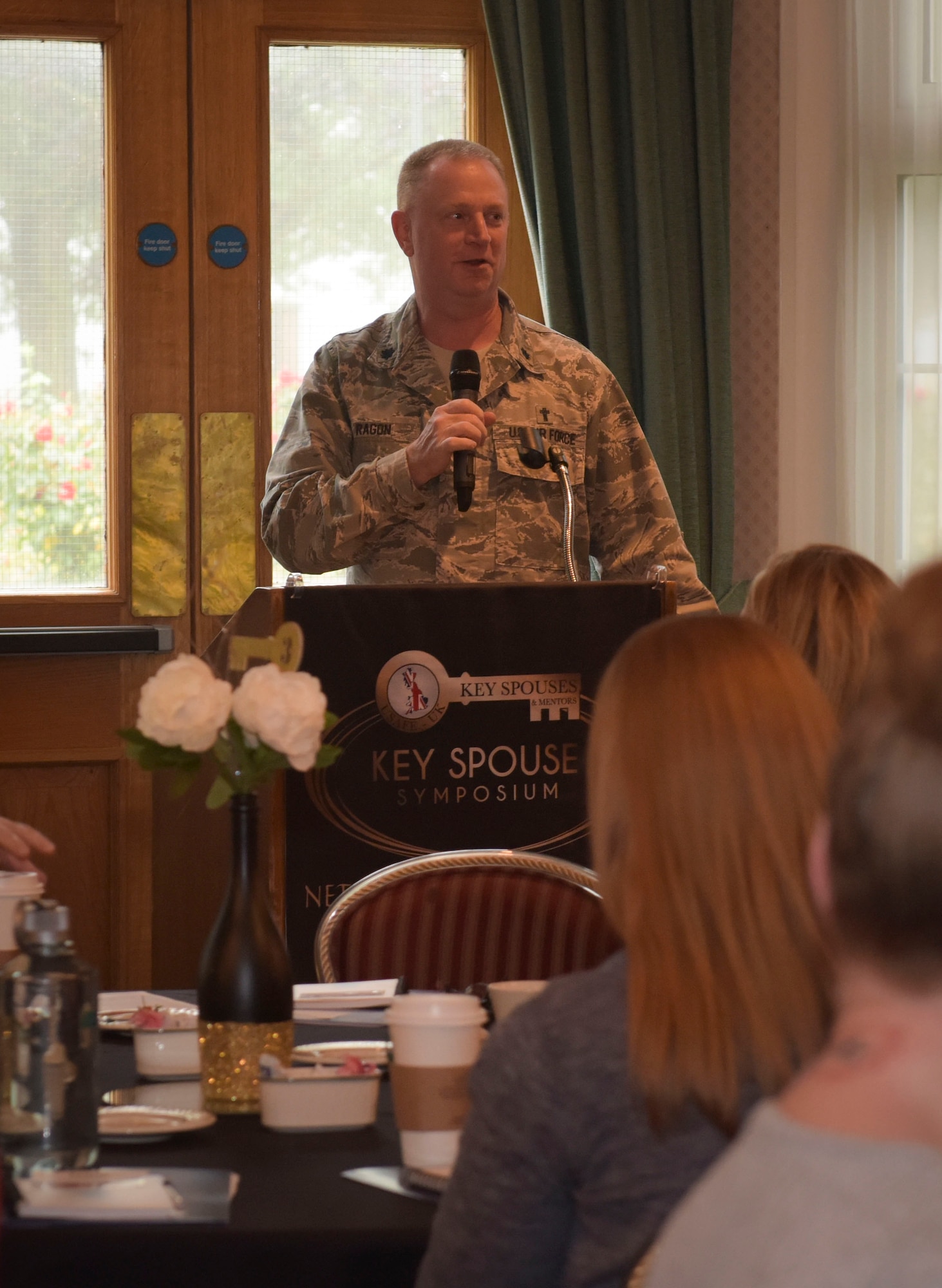 U.S. Air Force Chap. (Lt Col.) Ronald Ragon, 100th Air Refueling Wing chaplain, gives an opening welcome for the third annual Key Spouses Symposium hosted by Team Mildenhall Key Spouses at RAF Mildenhall, England, Oct. 4, 2018. More 250 spouses attended the third annual Key Spouses Symposium, where they shared ideas and strategies that worked for their units, and discussed steps to more effectively support for their squadron. (U.S. Air Force photo by Airman 1st Class Alexandria Lee)