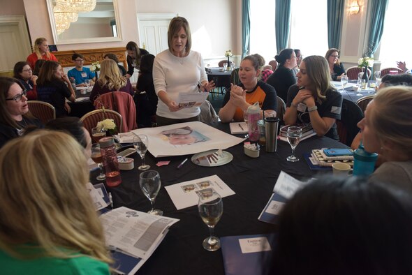 A group of key spouses participate in an icebreaker season during the third annual Key Spouses Symposium at RAF Mildenhall, England, Oct. 4, 2018. The spouses go through many training programs before getting the title of “Key Spouse” for their respective squadron including: initial training, resiliency training, and a course from the Airman Family and Readiness center training. (U.S. Air Force photo by Airman 1st Class Alexandria Lee)