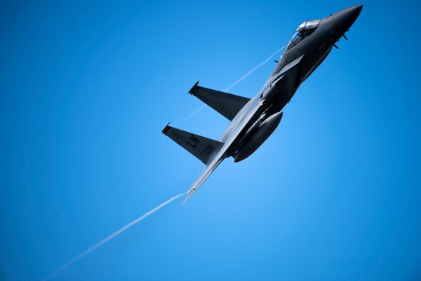 An F-15C Eagle assigned to the 493rd Fighter Squadron banks prior to landing Oct. 11, 2018, at RAF Lakenheath, U.K. The aircraft is training with fifth generation aircraft as a demonstration of U.S. commitment to European regional security. (U.S. Air Force photo by Senior Airman Malcolm Mayfield)