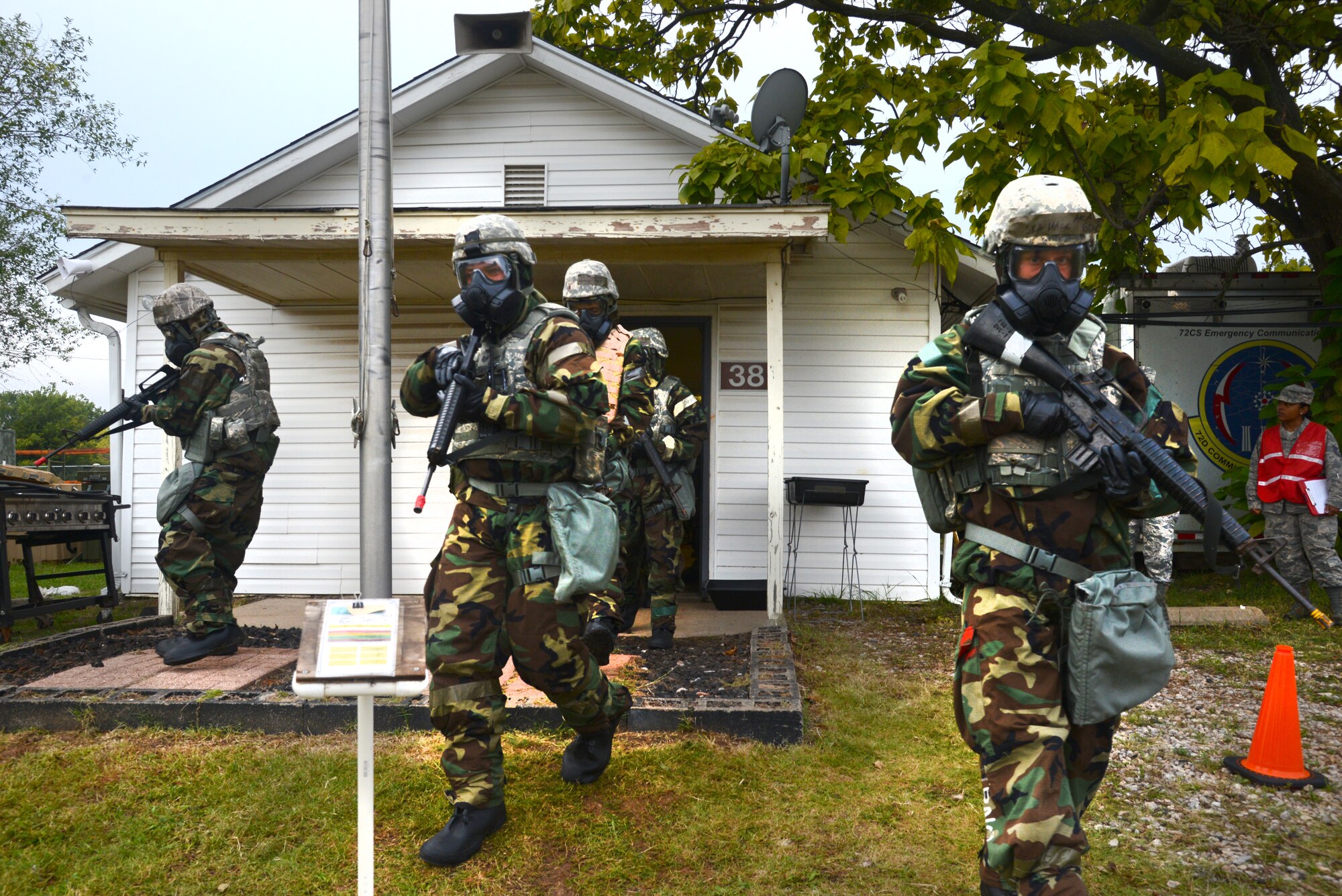 After the siren has gone off and the teams participating in the chemical, biological, radiological, nuclear, explosives exercise have suited up in Mission-Oriented Protective Posture 4 gear, they exit their enclosure to scour the perimeter for casualties, unexploded ordnance and contaminated areas. An M8 paper sits on a stand to determine the amount of liquid nerve or blister agents, which will help the team determine what further protective measures to take. Members from the 72nd Air Base Wing participated in the required CBRNE exercise Sept. 24-28, and also went through a personnel deployment function exercise to start the week.