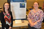 IMAGE: KING GEORGE, Va. (Sept. 25, 2018) – Associate investigators Teeya Roche and Megan Kozub are pictured at the Naval Surface Warfare Center Dahlgren Division (NSWCDD) In-house Laboratory Independent Research (ILIR) and Independent Applied Research (IAR) End of Year Review. They identified challenges, objectives, accomplishments and future benefits related to their IAR project -- “Data Visualization Support for Creation of a Numerical Table: Effects on Training and Performance” -- to Navy technical managers, engineers, and scientists as well as representatives from academia, industry, transition partners, and other key stakeholders. The innovative tool can reduce Sailor workload by minimizing the required sectors that a warfighter must monitor for each ship based on the global coverage area of the Fleet doctrine.