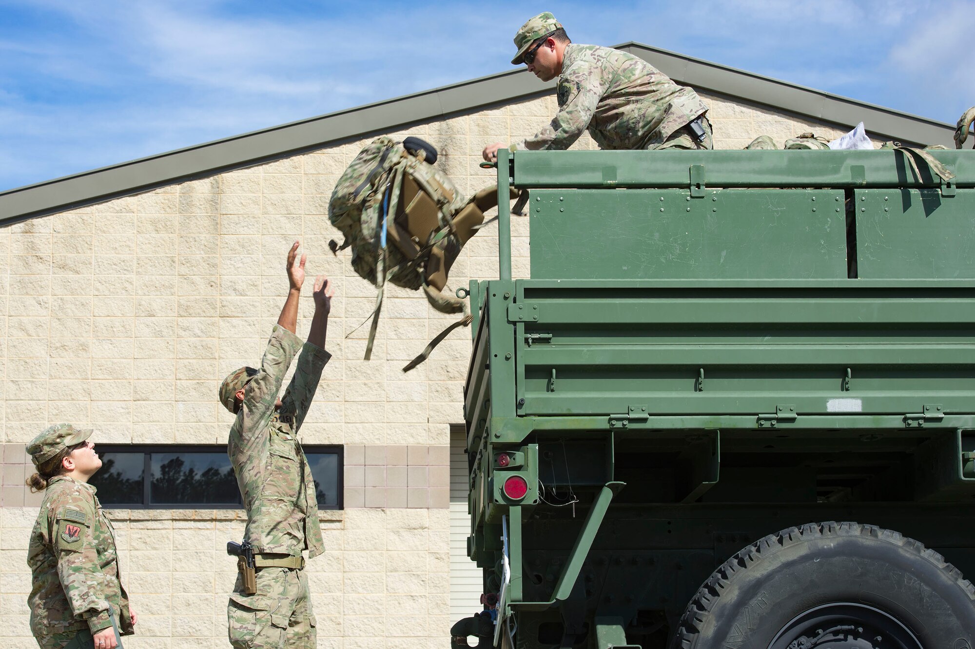 Airmen from the 822d Base Defense Squadron load up gear prior to departing Moody Air Force Base, Ga., to provide base security at Tyndall AFB, Fla., during Hurricane Michael recovery efforts, Oct. 11, 2018. Moody’s ‘Safeside’ defenders will secure the area as Tyndall’s Ride Out Element conducts damage assessments during the aftermath. Since Oct. 8 and until further notice, Tyndall has been on evacuation notice. (U.S. Air Force photo by Senior Airman Greg Nash)