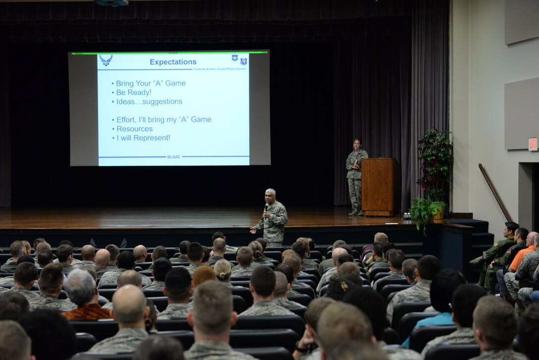 Chief Master Sgt. Raul Villarreal Jr., 14th Flying Training Wing command chief, describes how Team BLAZE is going to accomplish the wing mission during the wing’s all call, Oct. 5, 2018, at the Kaye Auditorium on Columbus Air Force Base, Mississippi. During the all call, Villarreal talked about his expectations for all 14 FTW Airmen. (U.S. Air Force photo by Airman Hannah Bean)