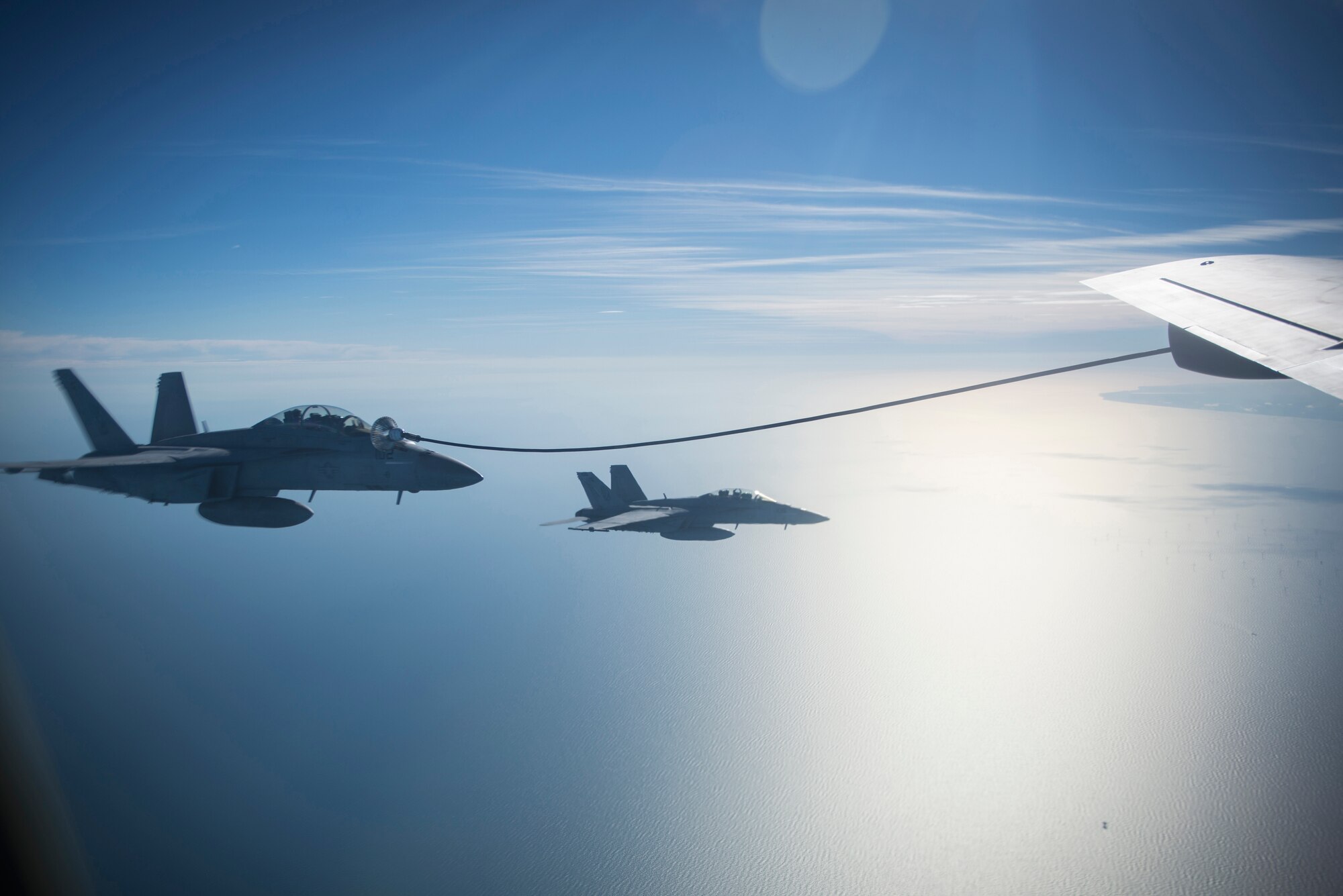 U.S. Navy F/A-18 Super Hornets assigned to the Carrier Air Wing from the USS Harry S. Truman (CVN-75), receive fuel from a U.S. Air Force KC-135 Stratotanker from RAF Mildenhall, during a large forces exercise off the coast of England, Oct. 11, 2018. RAF Lakenheath hosted a large force exercise that demonstrated U.S. ability to deter current and potential threats. (U.S. Air Force photo by Tech. Sgt. Emerson Nuñez)