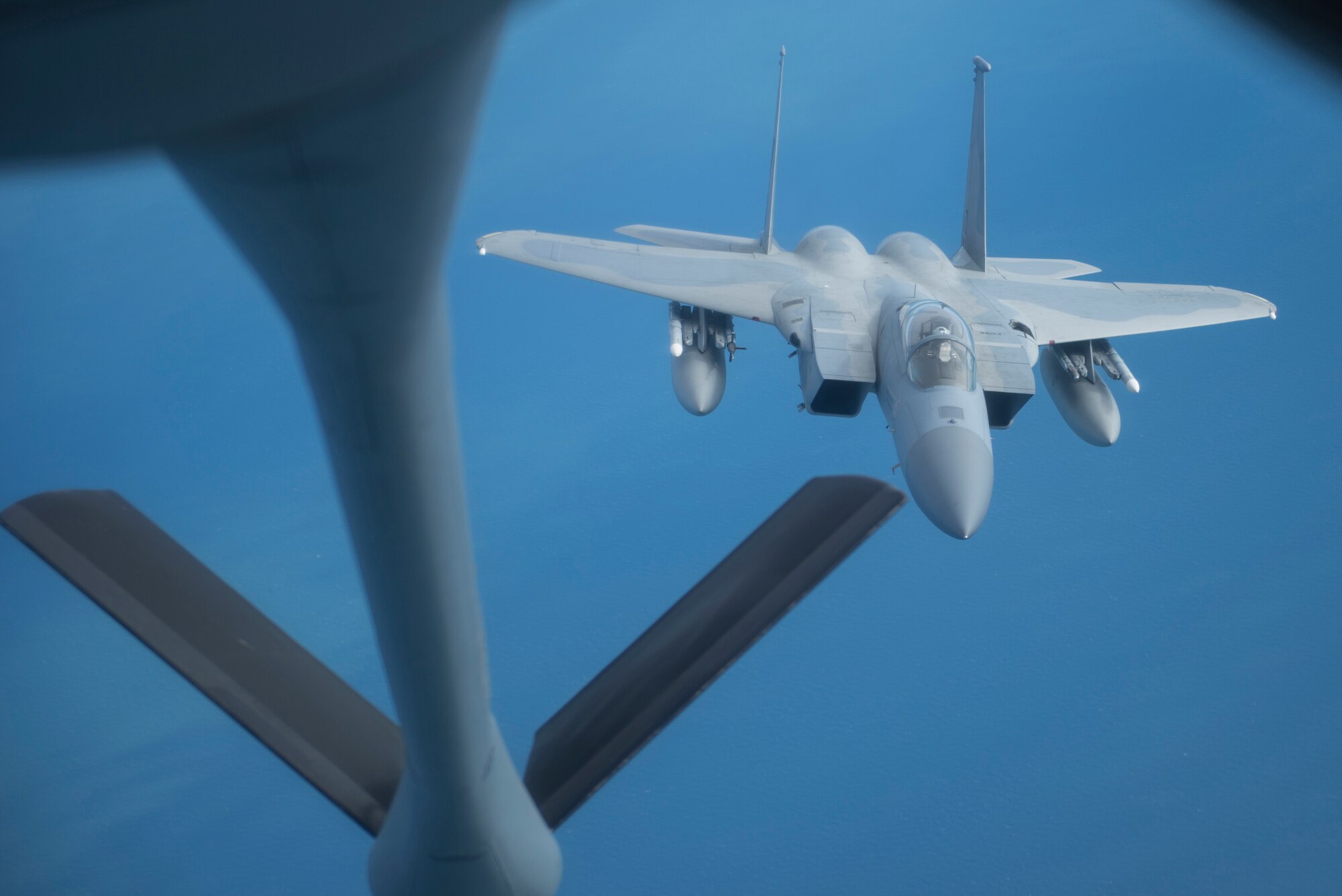 A U.S. Air Force F-15C Eagle assigned to RAF Lakenheath, England, takes on fuel from a U.S. Air Force KC-135 Stratotanker assigned to RAF Mildenhall, England, off the coast of England, Oct. 11, 2018. RAF Lakenheath hosted a large forces exercise that included F-22 Raptors from Joint Base Langley-Eustis, Va., F-15E Strike Eagles from RAF Lakenheath and F/A-18 Super Hornets from the Carrier Air Wing from USS Harry S. Truman (CVN-75). (U.S. Air Force photo by Tech. Sgt. Emerson Nuñez)