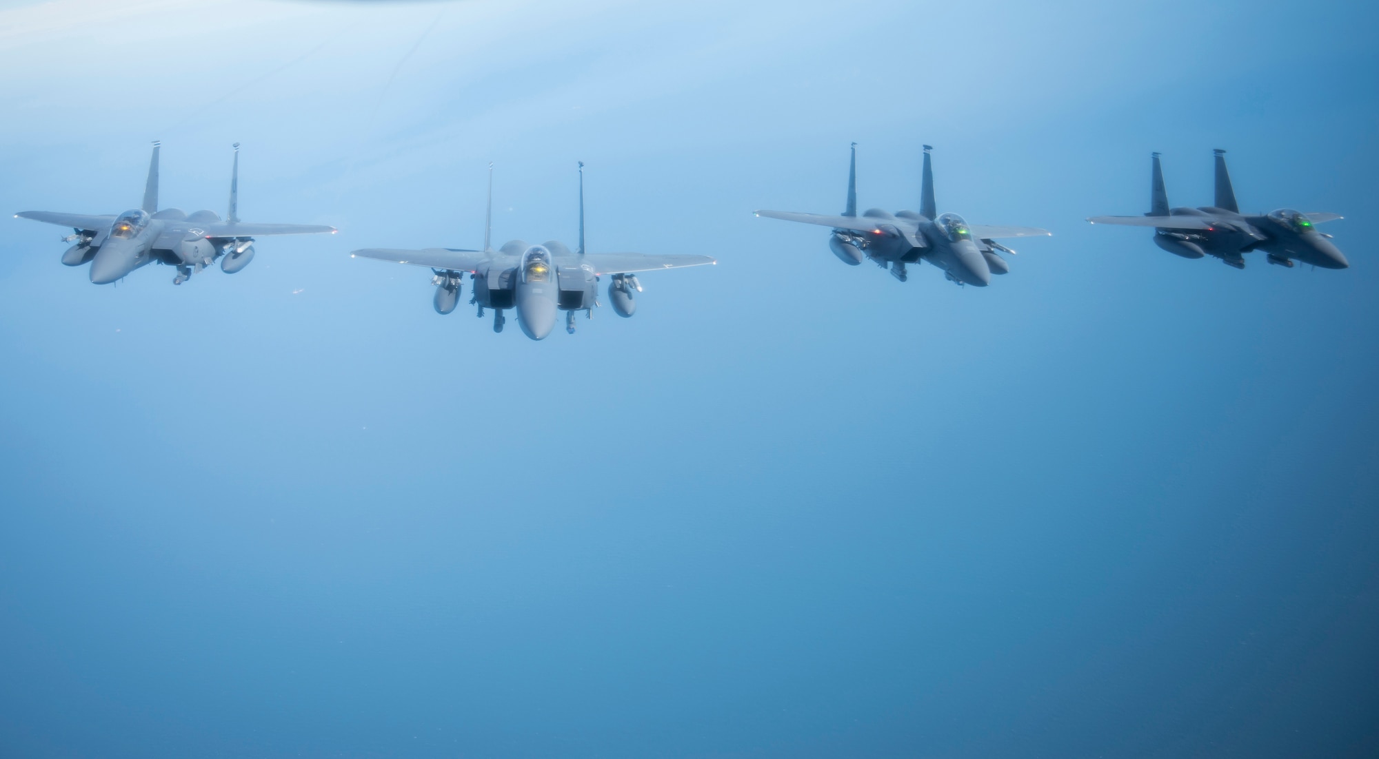 U.S. Air Force F-15E Strike Eagles assigned to RAF Lakenheath, England assemble in formation off the coast of England, Oct. 11, 2018. RAF Lakenheath hosted a large forces exercise that included F-22 Raptors from Joint Base Langley-Eustis, Va., F-15E Strike Eagles from RAF Lakenheath and F/A-18 Super Hornets from the Carrier Air Wing from USS Harry S. Truman (CVN-75). (U.S. Air Force photo by Tech. Sgt. Emerson Nuñez)
