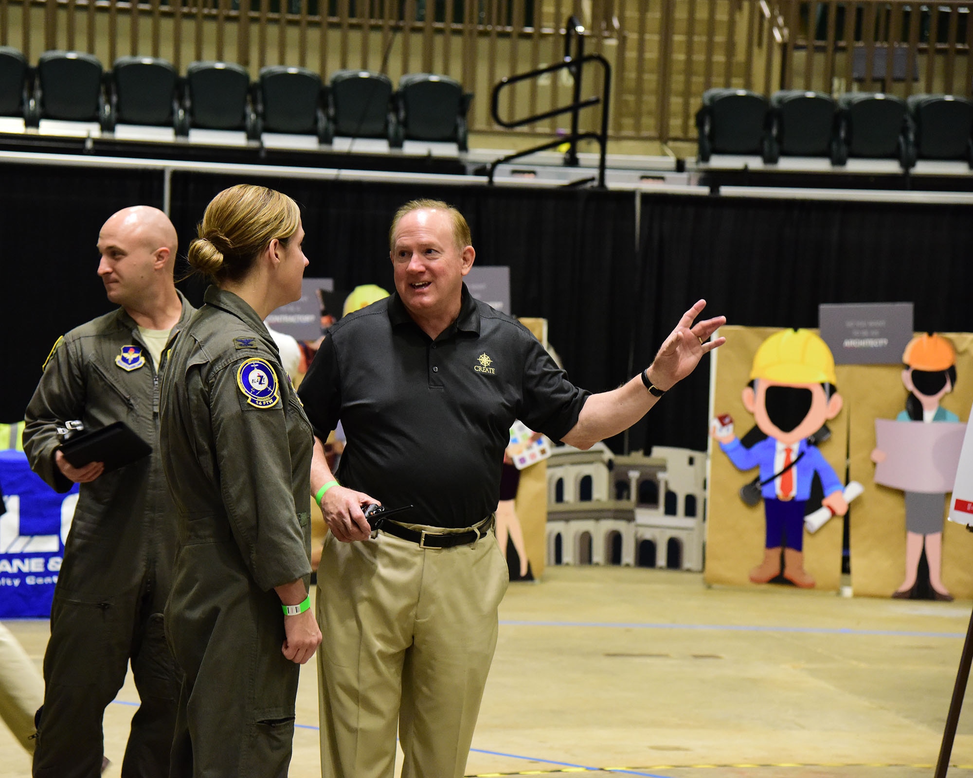 Col. Samantha Weeks, 14th Flying Training Wing commander, and Maj. Thomas Hyde, 14th Flying Training Wing commanders action group, tours the Imagine the Possibilities Career Expo with Mike Clayborne, president of the CREATE Foundation Oct. 2, 2018, at the BancorpSouth Arena in Tupelo, Mississippi. The three-day expo was hosted by the CREATE Foundation and was sponsored by more than 130 businesses to inspire local eighth-grade students. (U.S. Air Force photo by Elizabeth Owens)