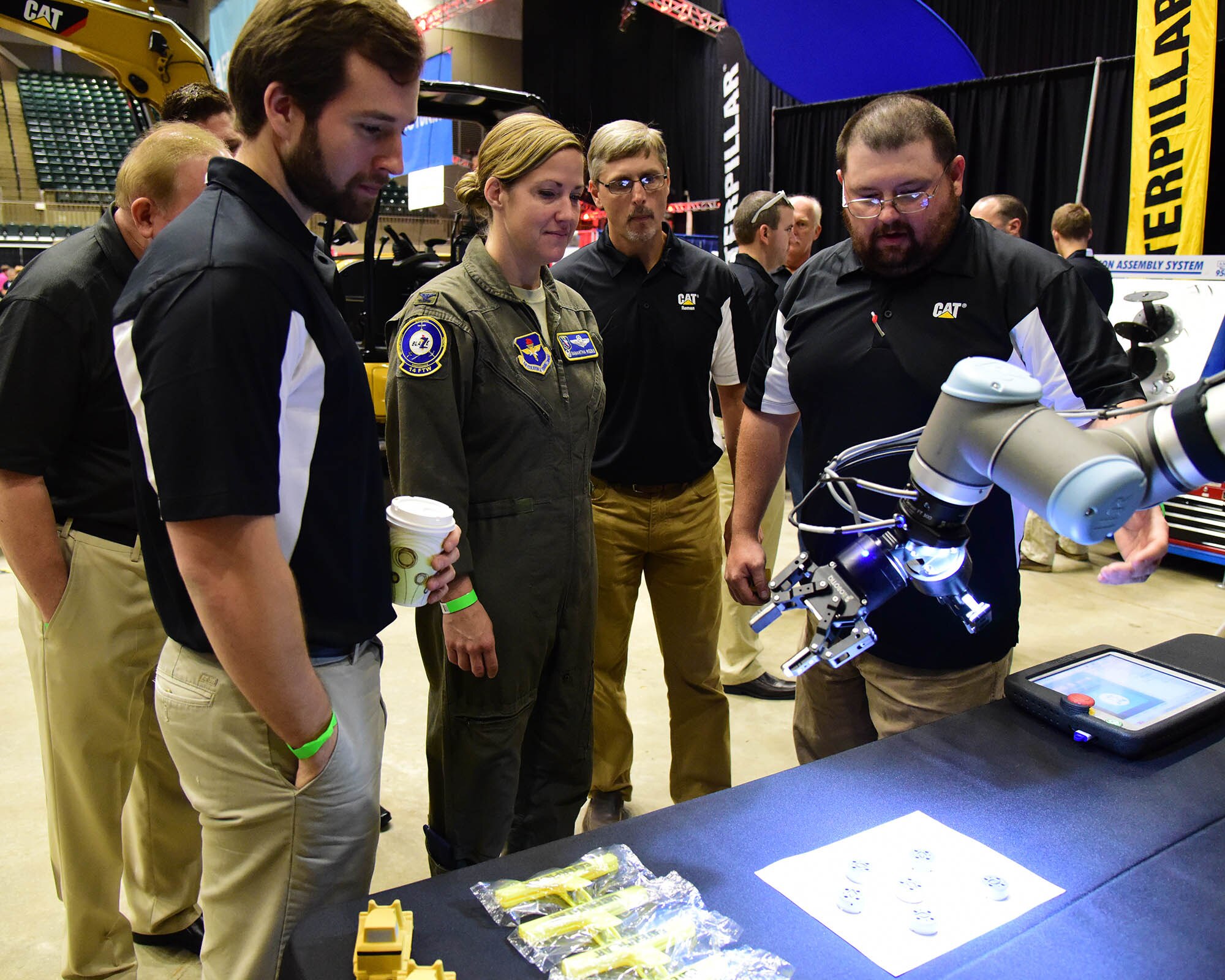 Col. Samantha Weeks, 14th Flying Training Wing commander, looks at a 3d printer duing the Imagine the Possibilities Career Expo, Oct. 2, 2018, at the BancorpSouth Arena in Tupelo, Mississippi. The three-day expo showcased hundreds of career opportunities and was sponsored by more than 130 businesses to inspire local eighth-grade students. (U.S. Air Force photo by Elizabeth Owens)