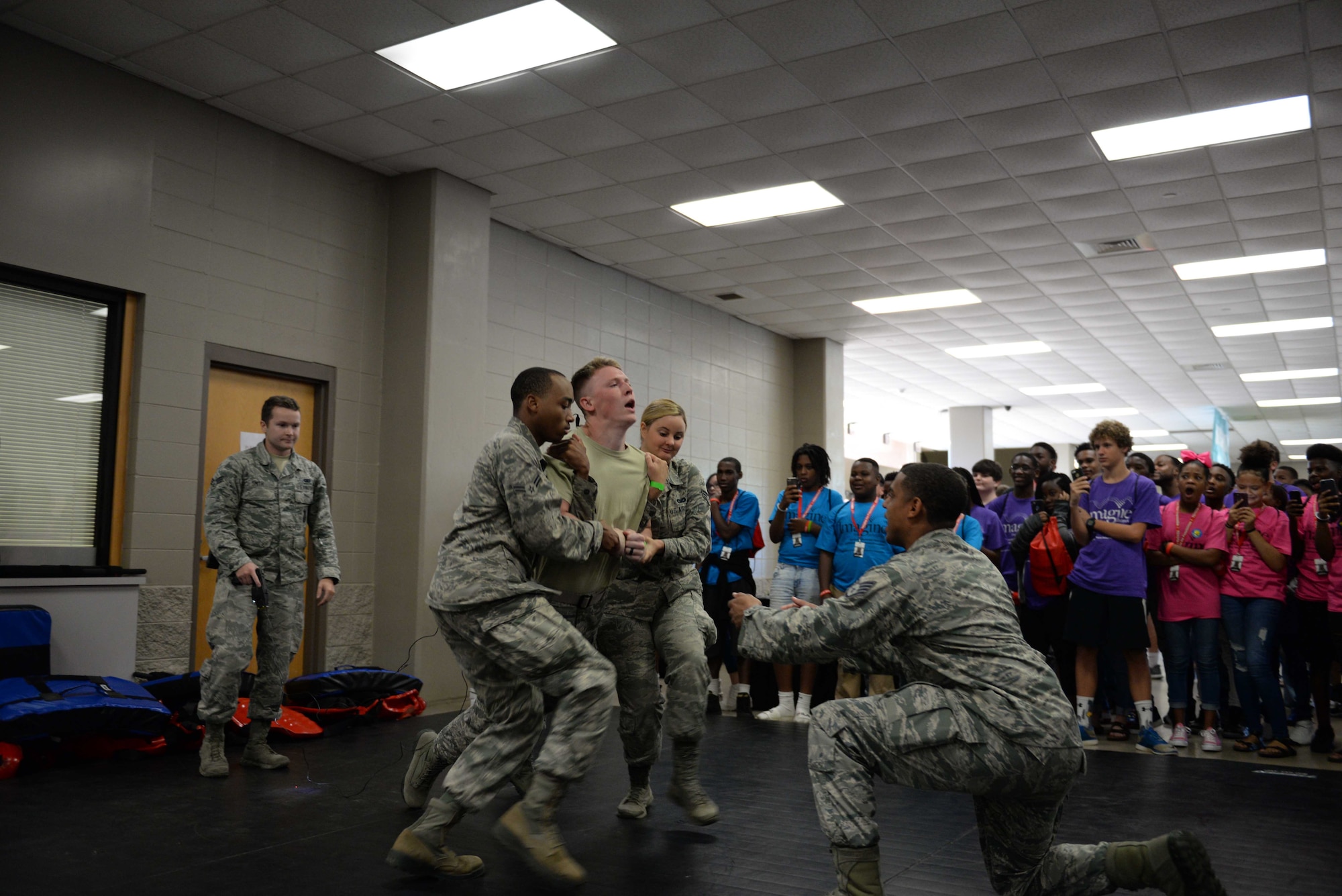 The 14th Security Forces Squadron gives a Taser demonstration Oct. 2, 2018, during the Imagine the Possibilities Career Expo at the BancorpSouth Arena in Tupelo, Mississippi. Law enforcement was one of the seven pathways at the expo with several demos of what it included. (U.S. Air Force photo by Airman Hannah Bean)