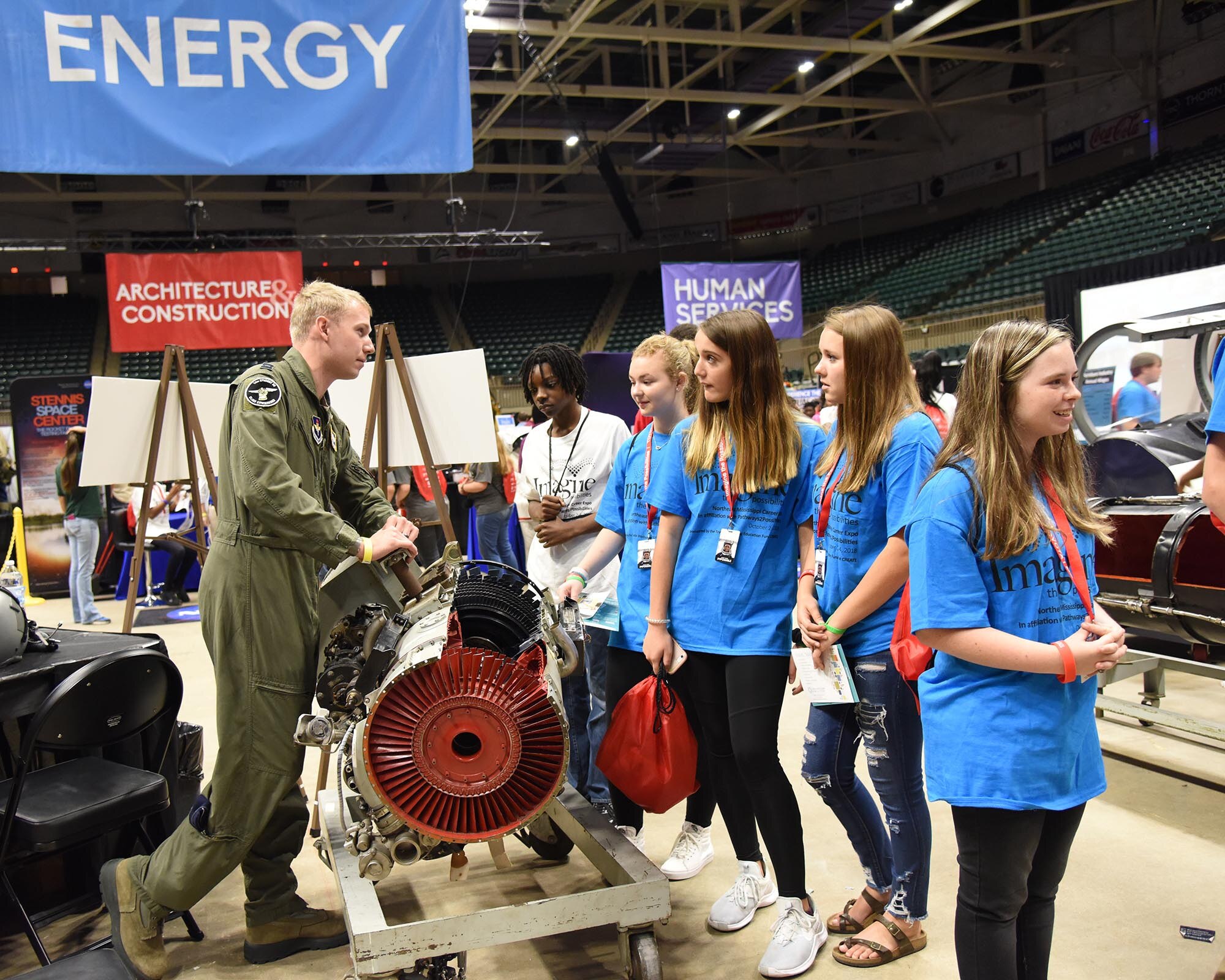 Capt. Chris Litscher, 14th Student Squadron flight commander, talks with students Oct. 2, 2018, during the Imagine the Possibilities Career Expo at the BancorpSouth Arena in Tupelo, Mississippi. Airmen showcased various aircraft models and aerospace tools and technologies at the expo. (U.S. Air Force photo by Melissa Doublin)