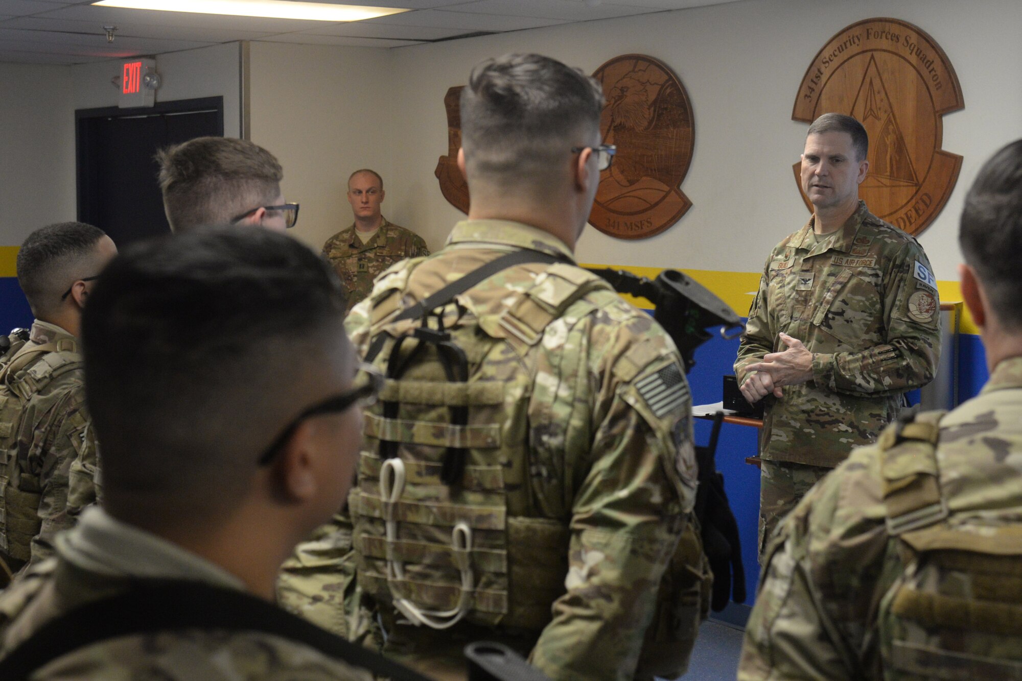 Col. Aaron Guill, 341st Security Forces Group commander, briefs defenders during guardmount Oct. 5, 2018, at Malmstrom Air Force Base, Mont.
