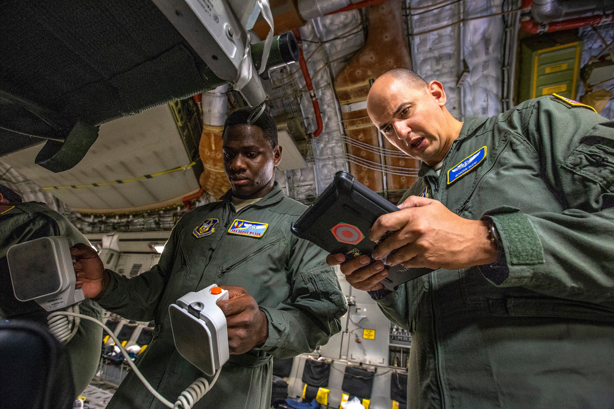 U.S. Air Force 1st Lt. Bogdan N. Suciu, right, a flight nurse with the 439th Aeromedical Evacuation Squadron (AES), and Senior Airman Darius L. Wilson, an aeromedical evacuation technician with the 45th AES, perform a function check of a defibrillator during a joint training mission with the 514th AES, 45th AES, and the 439th AES at Barbers Point, Hawaii Oct. 6, 2018. The 514th is an Air Force Reserve Command unit at Joint Base McGuire-Dix-Lakehurst, N.J. The 45th and the 439th AES are Air Force Reserve Command units from MacDill Air Force Base, Fla., and Westover Air Reserve Base, Mass. (U.S. Air Force photo by Master Sgt. Mark C. Olsen)