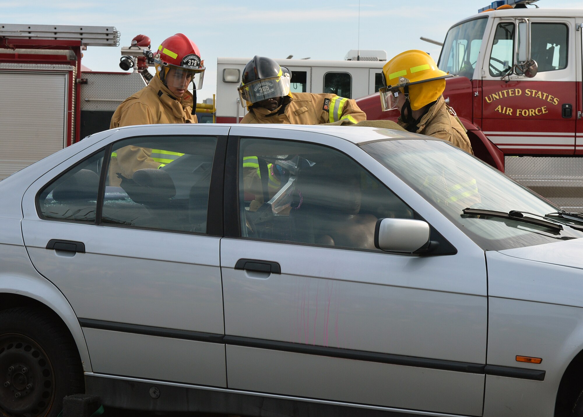 Firefighters from the 86th Civil Engineer Squadron perform an extrication exercise during an open house on Ramstein Air Base, Germany, Oct. 6, 2018. During Fire Prevention Week, members of the Kaiserslautern Military Community Fire and Emergency Services helped familiarize families with the importance of fire safety and how firefighters can help in emergency situations. (U.S. Air Force photo by Staff Sgt. Jimmie D. Pike)